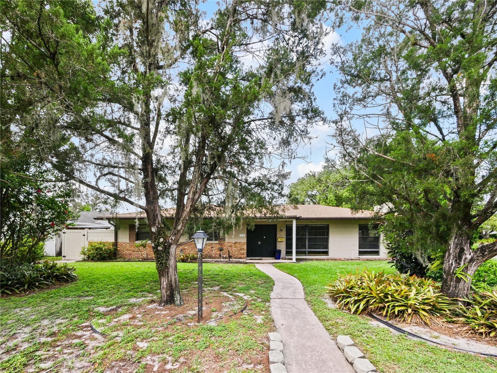 Here is a fantastic home in Winter Park Pines, a well established and sought after community and location in Winter Park! This property is located on a corner lot and has a private pool as well as a two-car garage. This a great way to obtain home ownership at an affordable price. The construction is a Block/Brick built home making it a solid home unlike one you could buy new today. The Roof and AC have been more recently replaced (2020 and 2021) so the property has Good Bones as they say. There have been some updates over the years. There is a mix of the old style as well as some of the new making this the perfect property to make your own. This could be a great First-Time Buyer opportunity! The home is a full 3 bedroom and 2 bath with a lot of square footage at almost 1800 Square feet of living area. The master suite is very large with a walk-in closet. There is a nook area which was previously used as an office but has other possibilities. The Family/Living room has a step-up as well as a fireplace. Many of the homes in this community are either fully renovated at much higher prices or in a condition that isn’t comfortably habitable and requires a significant investment to make livable. This home is the best of both worlds. Own your piece of Winter Park zoned for Winter Park schools. Book your showing today before it is gone.