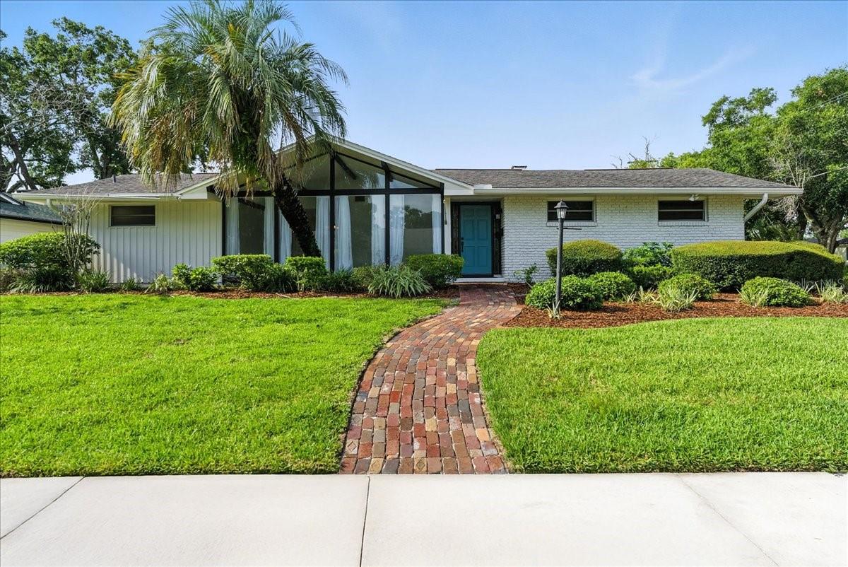 This 4-bedroom, 2-bath corner-lot home in the sought-after Dommerich neighborhood blends mid-century charm with thoughtful updates and room to grow. Set on a .27-acre lot with mature landscaping, a brick-paved walkway, and an oversized driveway, this home offers easy curb appeal and a warm welcome.
Inside, vaulted ceilings, exposed beams, and large windows fill the living spaces with natural light. A cozy family room with a fireplace and built-ins opens to a flexible layout, perfect for both everyday living and entertaining. The kitchen features solid-wood Amish cabinetry, quartz countertops, a built-in island cooktop, and new kitchen appliances.
Step through the screened-in porch into a private backyard retreat. You’ll find a large open-air pool, a covered patio for grilling and relaxing, and a concrete sports pad ideal for basketball, scooters, or even a future pickleball court. There’s space to stretch out, play, and host — whether it’s a quiet evening at home or a weekend gathering.
Recent upgrades include a 2019 roof, PEX plumbing, updated electrical panel (2021), newer AC and water heater, new pool equipment (2022), updated plank flooring, and fresh paint inside and out — the big-ticket items are already handled.
Zoned for top-rated Dommerich Elementary, Maitland Middle, and Winter Park High, and just minutes from parks, trails, and the dining and shops of Downtown Winter Park. This neighborhood is known for its friendly community, walkable streets, and long-term value.
If you’re looking for a home where your family can settle in, grow up, and make memories — 2400 Deloraine Trail is ready to welcome you.
Step outside through the screened sunroom to your private backyard oasis, complete with a sparkling swimming pool, expansive patio seating, and a large patio perfect for the grill and lounging, an entertainer’s delight. The home also includes a generous attached 2-car garage with laundry hookups and extra storage. Located just minutes from A-rated Dommerich Elementary, Maitland Middle, and Winter Park High, and close to Downtown Winter Park’s shops, restaurants, and cultural attractions, this home offers an exceptional lifestyle in a coveted neighborhood.