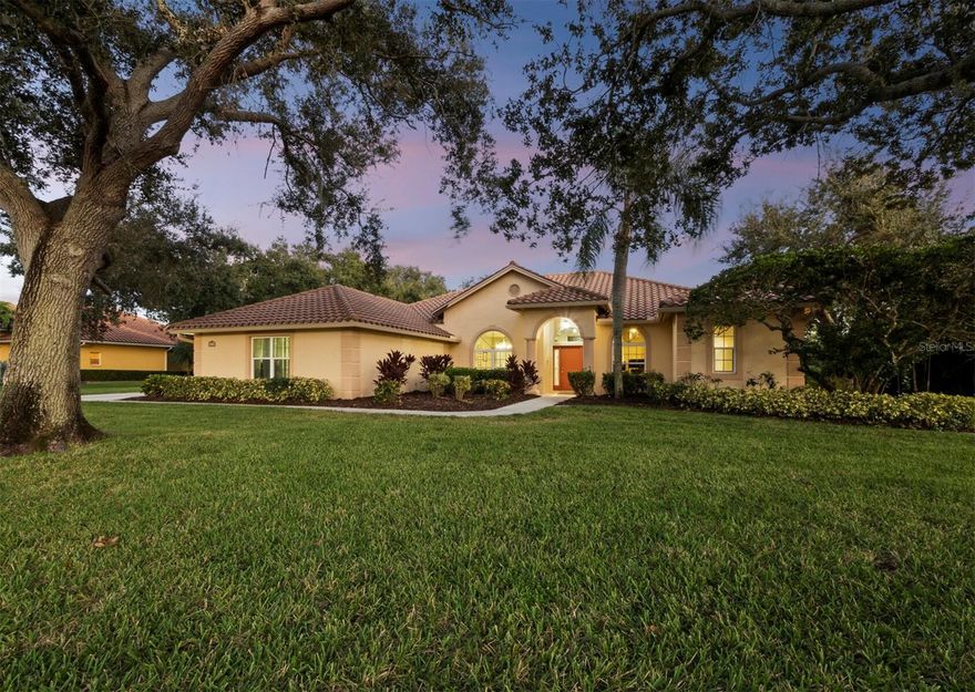 A peaceful retreat with an estate feel and exceptional privacy on a half-acre preserve lot in the gated Serenoa golf-course community. This meticulously maintained 4-bedroom, 3-bath, 3 car garage and pool home sits on an oversized homesite with no rear neighbor and only one neighbor to the side—mature oaks canopy the streets, a meandering side yard creek, and frequent deer, bunnies, and gracious crane visits create true country serenity. Inside, a bright split-plan layout provides privacy for the primary suite, while generous secondary bedrooms and spacious room sizes make everyday living easy. The great room with volume ceilings is built for entertaining and flows to a large lanai with pavered pool area and outdoor bar seating—perfect for gatherings. A formal dining room and living room complement the open kitchen/family room (with fireplace), and the side-entry garage enhances the estate look. Recent updates include a new pool cage, pool pump, newer impact windows and sliders, and electric fence. Serenoa offers optional membership at its golf club, uniquely designed custom homes on large lots, and beautiful oak-lined streets. You’re minutes to I-75 and convenient to all Sarasota amenities—an active downtown, cultural venues, and Siesta Key, Lido, and Longboat Key for beach and water sports. Zoned for Lakeview Elementary, Skye Ranch School, Sarasota Middle, and Riverview High, with Twin Lakes Park a short ride away. This home is ideal for year-round living, or it can provide the ultimate snowbird lifestyle. Move-in ready, private, and perfectly positioned to enjoy the best of Sarasota.