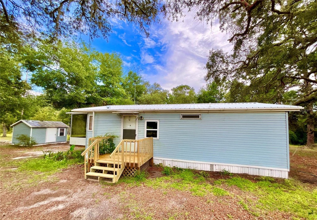 Photo of 107 Crystal Lake Drive, Melrose, FL 32666 (MLS # GC542984)
