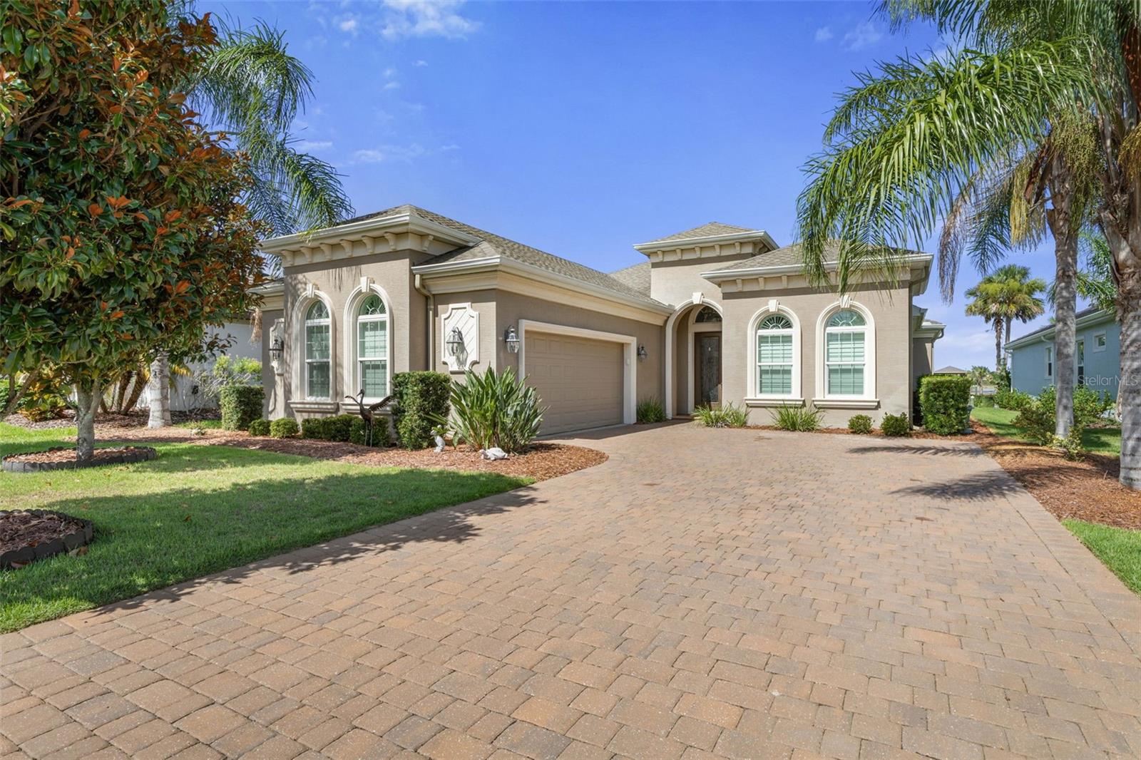 WATERFRONT RETREAT ON RIVERWALK! Welcome to your serene sanctuary nestled along the Intracoastal Waterway in the prestigious Palm Coast Plantation—where peace, privacy, and pristine natural beauty define the lifestyle. This luxurious, 2017 Built 4-bedroom, 3-bathroom waterfront home offers the ultimate coastal living experience, complete with a PRIVATE DOCK AND BOAT LIFT. From the moment you arrive, a stately paver driveway and lush landscaping set the tone for elegance and tranquility. Step inside to discover 2,593 square feet of open, light-filled living space with soaring ceilings, architectural niches, and designer finishes throughout—all perfectly oriented to showcase breathtaking WATER VIEWS The heart of the home is a gourmet kitchen designed for both function and style, showcasing a massive quartz countertop island with storage cabinets on both sides, cooktop oven, stainless steel appliances, a VAST WALK-IN PANTRY and a charming breakfast nook with a wide mitered glass window framing STUNNING SUNRISES over the ICW. The spacious primary suite is a private retreat boasting a tray ceiling, plantation shutters, two walk-in closets, two vanities, a soaking tub, and a floor-to-ceiling tiled walk-in shower. Carefully designed floor plan is the optimal blend of shared and private spaces: offering ample gathering space to make memories with friends and family, along with plenty of separation between primary and secondary bedrooms for enhanced privacy. Other Notable Features of the Home Include: Split Floor Plan, Plantation Shutters, Built-in Closets in the Bedrooms, Electric Blinds on Sliding Glass Doors, Wireless Remote for Boat Lift, Large Laundry Room, Side Entry Garage(with Epoxy Flooring), Beverage Cooler and SO MUCH MORE!! Palm Coast Plantation is one of Palm Coast’s Premier Communities and Offers: 24/7 Guarded Gate, Top Quality Tennis/Pickleball Courts, Fishing, A Massive Clubhouse, Kayaking, Fitness Center, Pool and Spa. Affordable RV and Boat Storage are also available right within the community! Conveniently located close to shopping, schools, golf courses and just a short drive to THE BEACH. Contact us today to schedule a private tour.