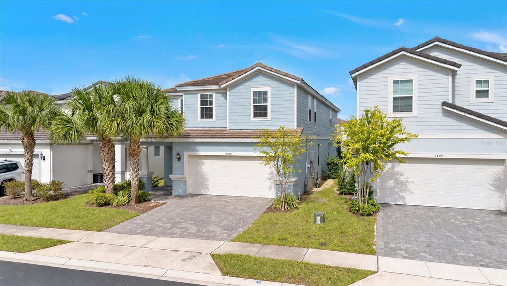 Photo of 7400 Oakmoss Loop, Davenport, FL 33837 (MLS # O6450882)