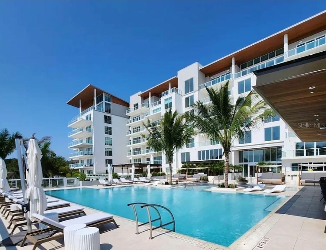 Welcome to Unit 505 at Serena by the Sea – where luxury meets waterfront living in the heart of Clearwater, Florida.
This brand-new 2023 construction is fully furnished and move-in ready, blending modern elegance with coastal tranquility. With 2 spacious bedrooms, 3 spa-inspired bathrooms, and a dedicated office, this 1,824 sq ft residence is crafted for both relaxation and sophistication.
Step inside to discover porcelain tile floors and a custom Italian kitchen fitted with premium Gaggenau appliances, designed for those who love to cook and entertain. Custom-built luxury Italian closets provide ample storage with exquisite craftsmanship throughout.
Wake up each morning to panoramic water views through floor-to-ceiling glass doors that open to your private balcony – perfect for watching dolphins play or enjoying a peaceful sunset. The open-concept living space is bathed in natural light, with designer furnishings that elevate every detail.
Residents enjoy over 23,000 sq ft of five-star amenities, including a resort-style pool, indoor/outdoor fitness center, spa, social lounges, and concierge service – all within a secure, exclusive building just minutes from Clearwater Beach, the Dunedin Marina, fine dining, and vibrant local culture.
Whether you're looking for a luxury vacation home or a primary waterfront residence, Unit 505 delivers unmatched lifestyle and investment potential in one of Tampa Bay’s most desirable new developments.
Your waterfront paradise awaits.