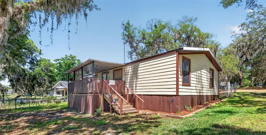 Check out this great 3-bedroom, 2 Bath home, with a metal roof installed in 2023, hardy-board siding, home was built in 1987, with a view of the spring-fed Lake Indianolia. This home is in a rural setting but still close to town, has indoor laundry, a chain-link-fenced yard, and a front porch ready for you to sit and enjoy your morning coffee. This property enjoys convenient access to daily essentials and regional destinations. Nearby schools include Fruitland Park Elementary, Carver Middle School, and Leesburg High School. Medical care is close at hand with UF Health Leesburg Hospital and Advent Health Waterman in nearby Tavares. Grocery shopping and everyday conveniences are just minutes away along US 441 and in the Leesburg retail corridor. The home is well-positioned near major roadways, including US Highway 441 and the Florida Turnpike, providing straightforward access to Leesburg, The Villages, Tavares, and Mount Dora. Orlando International Airport is approximately an hour away, making travel and connectivity easy for seasonal or full-time residents. This is a strong opportunity for investors, renovators, or buyers looking to create value through improvements in a convenient Central Florida location. Let's not stop here, the seller also has a detached in-law suite or rental property on MLS#G5112497 1708 INDIAN TRAIL LEESBURG