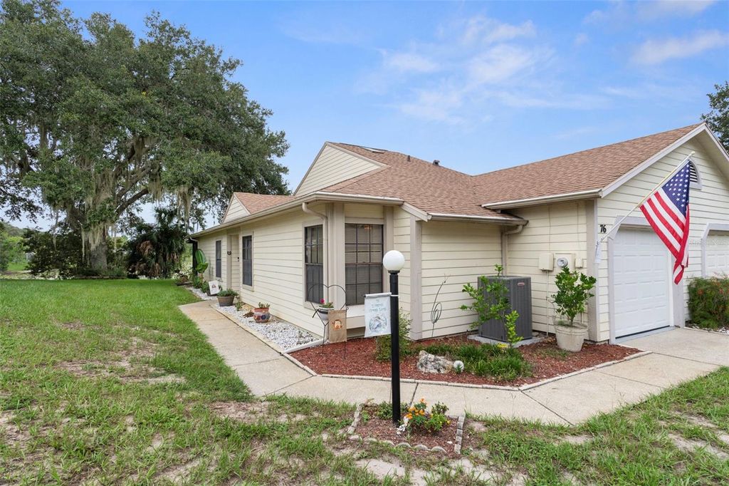 Photo of 76 S Heron Creek Loop, Inverness, FL 34450 (MLS # OM709696)