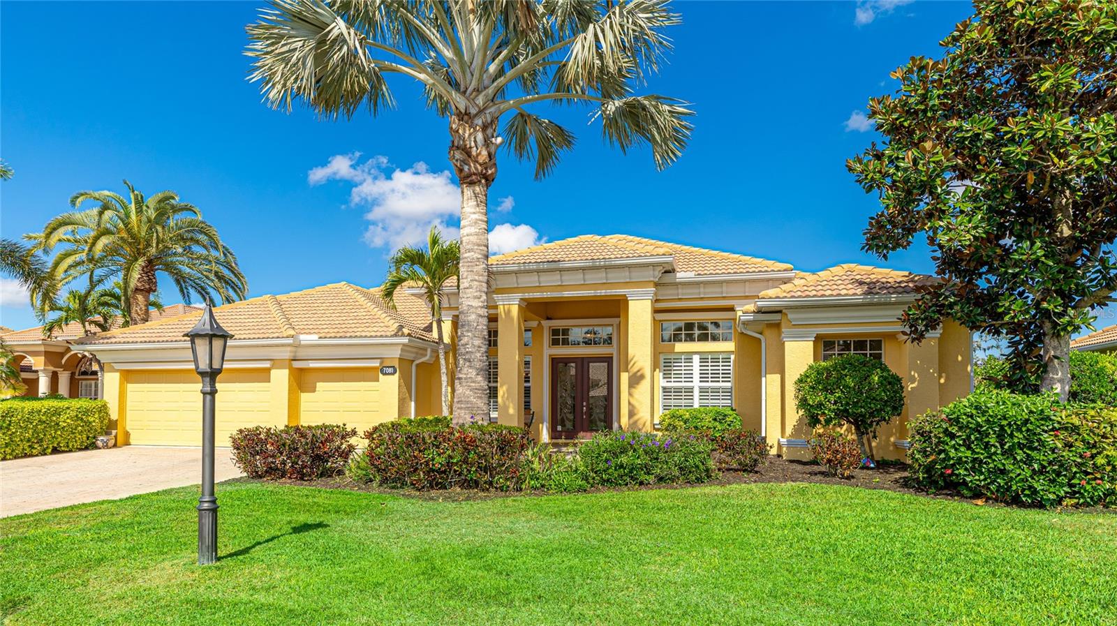 Welcome to 7081 Grassland Court, a beautifully maintained estate home in the highly desirable gated community of Red Hawk Reserve. Built by the luxury division of U.S. Homes, this upgraded Oxford Model is one of the most popular floor plans, offering over 3,600 sq. ft. of single-level living on a premium homesite with peaceful views of the pond and preserve.
Elegant features include 14-foot ceilings, 8-foot doors, crown molding, and hardwood flooring throughout the main living areas. The open-concept design is ideal for entertaining, with a spacious gourmet kitchen featuring granite countertops, designer cabinetry, stainless steel appliances, and a large center island that flows effortlessly into the family room and out to the screened lanai.
The owner’s suite offers a private retreat with a sitting area, dual walk-in closets with custom built-ins, and a luxurious en-suite bath with dual vanities, a Roman shower, and a soaking tub. The additional bedrooms feature 10’ ceilings and are connected by a Jack-and-Jill bath, while the den serves as the perfect home office or flex room.
Step outside to enjoy the expansive screened lanai with brick-paver decking, a heated pool and spa, and serene views framed by mature oaks and tropical landscaping. The home also includes a whole-house Culligan water treatment system, plantation shutters, hurricane impact windows and shutters, and an immaculate 3-car garage.
Red Hawk Reserve is a well-established community with low HOA fees, no CDD, sidewalks, and an unbeatable Sarasota location just minutes to I-75, Twin Lakes Park, top-rated schools, and Siesta Key Beach—ranked #1 in the U.S.
This is luxury Florida living at its finest—move-in ready, meticulously cared for, and perfectly located.