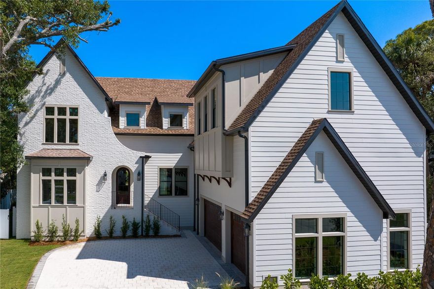 BRAND NEW CONSTRUCTION JUST COMPLETED! This Modern Tudor Custom Spec Home is unlike anything you've ever seen before, nestled in the charming neighborhood of Sunset Park offering a unique blend of classic elegance and simplistic design. This 5 bedroom, 4.5 bathroom plus two bonus rooms and private pool residence is tailored for both comfort and style. The architecture stands out with its distinct combination of Tudor influences , featuring steeply pitched roofs, decorative half timbering, and expansive windows all reimagined with modern touches that seamlessly integrate into the landscape. Inside, you'll be impressed with the open-concept layout creating a perfect flow between living spaces while the high end finishes and bespoke details elevate the homes aesthetic. Step into the gourmet kitchen equipped with top tier appliances and custom cabinetry, which is ideal for both everyday living and entertaining. The living and dining rooms are bathed in all natural light. Upstairs you'll find the primary suite which serves as a private retreat, complete with a spa like ensuite bathroom, while the additional bedrooms and bonus loft offer ample space and style. Outside you'll find a summer kitchen and private pool/spa perfect for outdoor gatherings. This home represents the perfect fusion of timeless design and modern luxury, creating an exceptional living experience in one of the best neighborhoods in all of South Tampa. Located close to Tampa International Airport, Shops, Restaurants and so much more.