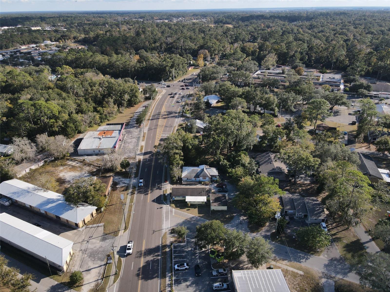 Rare commercial opportunity! With an average of 12,200 DAILY traffic count and combined frontage of 250+ ft, this Mixed-Use corner lot (platted as 5 separate lots) off NW 6th St is yours to rediscover! Live in the single family residential and operate the store/retail building. The MU-1 zoning could allow for a wide range of businesses like possibly a drive thru but do check with the City. The store has an attached big storage area that can possibly be brought to code for living space/rental. The residential building has space that can be re-imagined as well! Or tear down the buildings and redevelop the property! So much potential this parcel can offer. Please call the City to learn ALL the possibilities. Residential building has new AC and beautiful original floors. The store has walk-in cooler, 2 other sets of coolers, shelves and more space once you see the inside! Call now!