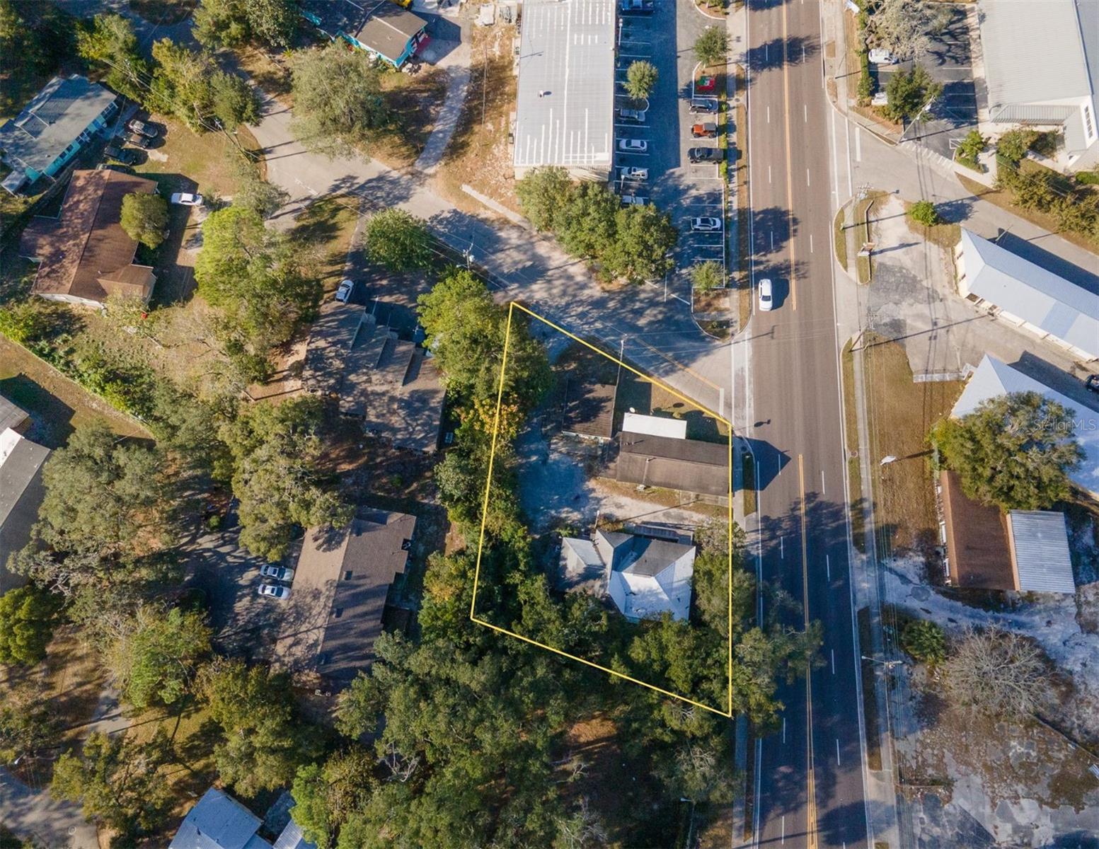 Rare commercial opportunity! With an average of 12,200 DAILY traffic count and combined frontage of 250+ ft, this Mixed-Use corner lot (platted as 5 separate lots) off NW 6th St is yours to rediscover! Live in the single family residential and operate the store/retail building. The MU-1 zoning could allow for a wide range of businesses like possibly a drive thru but do check with the City. The store has an attached big storage area that can possibly be brought to code for living space/rental. The residential building has space that can be re-imagined as well! Or tear down the buildings and redevelop the property! So much potential this parcel can offer. Please call the City to learn ALL the possibilities. Residential building has new AC and beautiful original floors. The store has walk-in cooler, 2 other sets of coolers, shelves and more space once you see the inside! Call now!