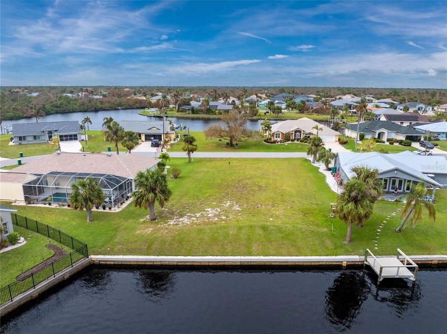 Aerial & drone video available! Build your dream home on this stunning waterfront lot in Port Charlotte, FL! Enjoy sailboat access to the Gulf—no fixed bridges, just minutes away. This cleared, leveled lot features a new seawall (2022), plus city water, sewer, and high-speed internet—no HOA, septic, or well needed.
Nestled along a peaceful, mangrove-lined channel, it offers both privacy and paradise.
Priced below market—don’t miss out!
