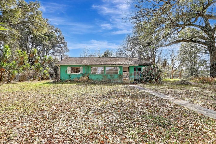 Discover the potential of this 2-bedroom, 1-bathroom single-family home in Citra, FL, offering 1,012 square feet of space on a sprawling 4-acre lot. Perfect for investors or those ready to bring their vision to life, this property provides endless possibilities for customization, expansion, or creating a private retreat. The home features solid wood cabinets in the spacious kitchen, an updated AC system, a new water heater, a recently installed well pump, and freshly cleaned and resealed AC ducts—key updates that provide a strong foundation for future improvements. Set on four acres of private land, there’s room to garden, entertain, or explore creative projects while enjoying the peaceful, rural setting. Despite its tranquil location, the property is just minutes from grocery stores, shopping, and dining, with Ocala only a short drive away. Convenient access to highways makes commuting or weekend getaways straightforward. This property offers a rare combination of space, potential, and location, inviting buyers to transform it into a personalized home or investment opportunity. Bring your imagination and take advantage of this unique chance to craft something truly special in Citra. Mortgage savings may be available for buyers of this listing. CASH ONLY SALE!