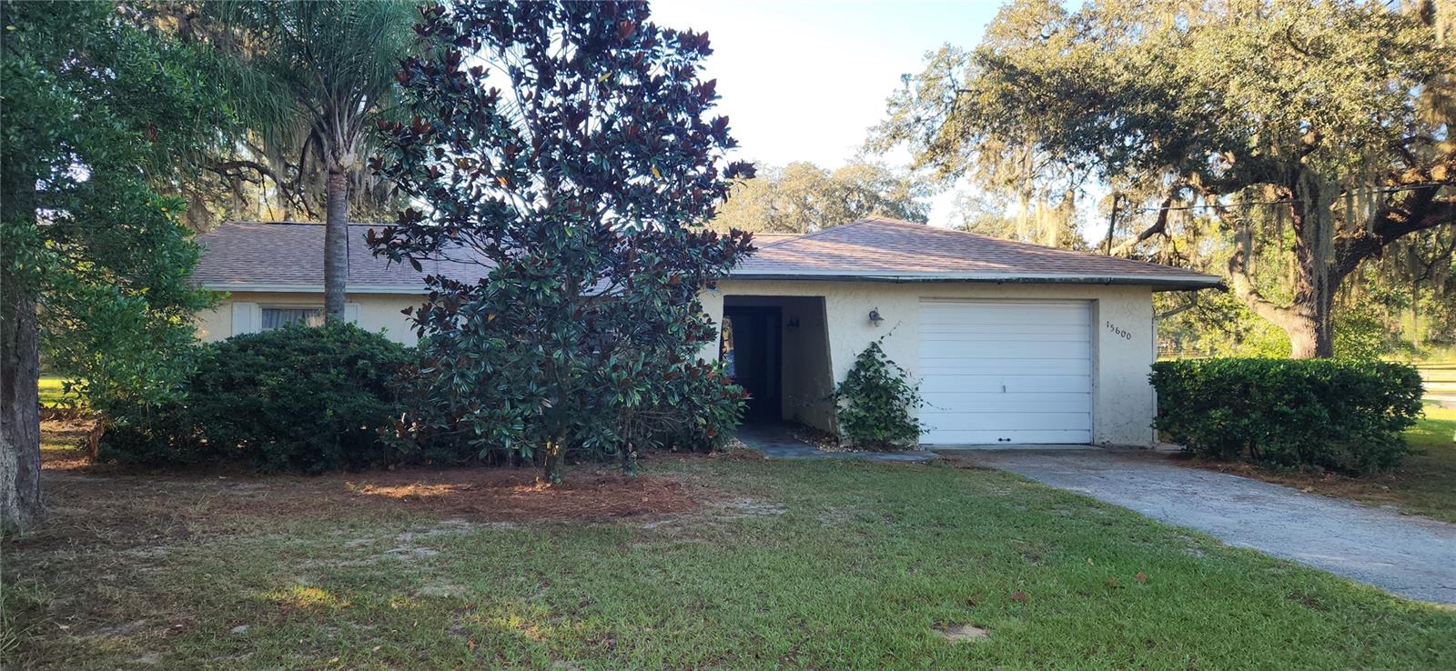 This property is a dream come true for horse lovers. This 3-bedroom, 2-bathroom concrete block stucco home has the perfect country setting. The master bedroom has a large walk-in closet. The bedroom has a sliding door that leads to the back porch. There you can enjoy a cup of coffee and watch you horses grazing in the morning. Just imagine, looking out your windows to beautiful pastures and majestic oak trees. On the cool evenings, you can sit by the fireplace that is located in the family room. The split floor plan provides privacy for family members. The house and shed had a new roof installed in June of 2025. This property is in not in a flood zone and there is no HOA. It is only 10 miles to the World Equestrian Center. This fully fenced in 9.69 acres has 9 paddocks and pastures to provide rotational turnout for your horses. The barn is equipped with 5 stalls, a tack room and hay storage area. The barn stays nice and cool for those hot Florida days. The round pen is an added bonus. Schedule your showing today. Don't miss out on this unique property located in the horse capital of the US.