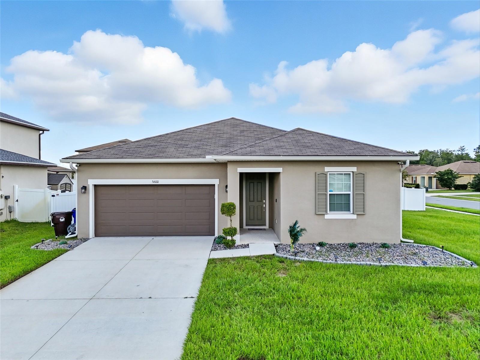 Lake Nona Lifestyle Without the Price Tag!! This stunning 3-bedroom, 2-bathroom corner-lot home places you just 8 miles from the vibrant Lake Nona scene—enjoy foodie favorites at Boxi Park and the innovation of Medical City. Grocery Shopping at Publix is only minutes away. A welcoming entryway leads you to two spacious bedrooms and a full guest bathroom. The open-concept kitchen, living, and dining areas are perfect for modern living, with sleek finishes and abundant natural light. A versatile bonus space off the main living area can easily be transformed into a home office or study room. The primary suite is a true retreat, featuring a walk-in closet, barn-door entry to the spa-inspired bathroom with dual vanities, granite countertops, and a glass-enclosed shower. The chef’s kitchen boasts modern lighting, recessed fixtures, stainless steel appliances, generous cabinet storage, and pantry. Step outside to a large, fully fenced backyard, ideal for gatherings, relaxation, or entertaining under the stars.