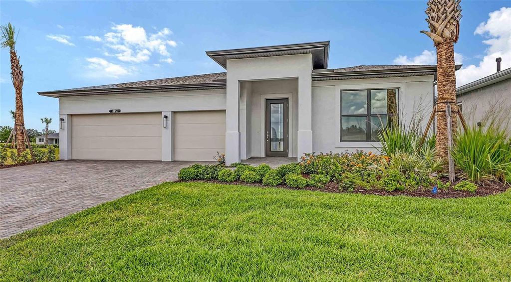 Photo of 14451 Coastal Woodland Lane, Parrish, FL 34219 (MLS # O6272174)