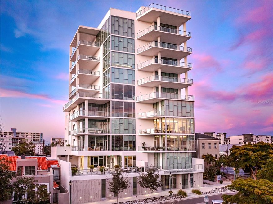 Welcome to The Collection, a majestic residence located in the heart of Sarasota’s vibrant arts district. This 3-bedroom, 3-bathroom luxury condo spans 2,547 sq ft and offers an unparalleled lifestyle with sweeping city views through 12-foot floor-to-ceiling windows. The open-concept design seamlessly connects the expansive living and dining areas, perfect for both entertaining and relaxing. The gourmet kitchen is equipped with top-of-the-line Miele appliances and custom cabinetry. The primary suite is a true retreat, featuring a spa-inspired bathroom with a freestanding soaking tub, walk-in shower, dual vanities, and a custom walk-in closet. Two additional guest rooms with ensuite bathrooms provide the utmost comfort and privacy. Step outside onto your private balcony, where the vibrant city of Sarasota comes alive in the evening, with twinkling lights and the energy of the nightlife filling the air. Enjoy the convenience of being just steps from world-class dining, entertainment, and the Sarasota Opera House. Rooftop restaurants, bars, and more are all within walking distance, and a short walk takes you to the waterfront and Bayfront Park. Plus, you’re just a short drive from Lido Beach, Siesta Key Beach, St. Armands Circle, and Sarasota Airport, offering easy access to the best of Sarasota and beyond. Gated access and two deeded parking spaces ensure both security and ease. Private elevator access adds an extra layer of exclusivity. Priced for today's market at $2,295,000, this residence at The Collection offers an extraordinary living experience in one of Sarasota’s most coveted locations.