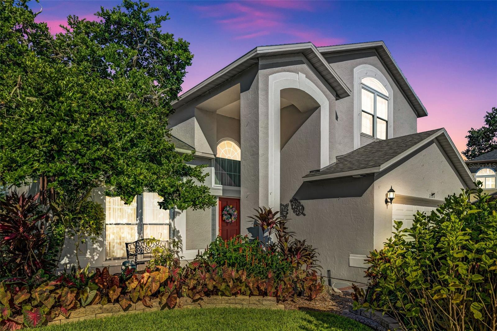 Tropical oasis landscaped charming 4 bedroom 2 1/2 bath pond front, pool home at end of cul de sac in centrally located yet privately secluded Sterling Ranch.