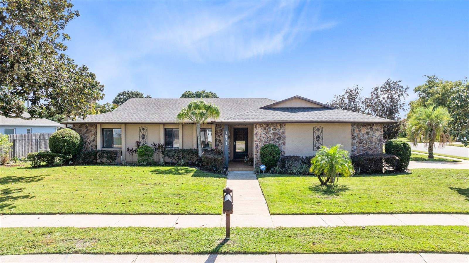 One or more photo(s) has been virtually staged. **2025 ROOF** Pride of ownership shines throughout this well maintained 3 Bedroom + OFFICE home, ideally situated on a spacious corner lot in a quiet, neighborhood with NO HOA. With 2,031 square feet of living area including the enclosed porch, this property offers exceptional flexibility and room to grow. Step inside and immediately feel at home in the bright, open layout featuring soaring vaulted ceilings, neutral tones, and wood look luxury vinyl plank flooring that flows seamlessly throughout the home. The living room welcomes you with abundant natural light and a sense of openness, leading into a dedicated formal dining area that overlooks both the pool and main living areas, perfect for family gatherings or entertaining friends. The updated kitchen has been tastefully renovated with custom cabinetry, quartz countertops, and stainless steel appliances, creating a functional space that opens directly to the family room. Whether you’re preparing meals, watching a movie, or keeping an eye on the pool, this layout ensures you’re always part of the action. From the family room, sliding glass doors open to the expansive enclosed porch, a versatile bonus area surrounded by windows on two sides that let in plenty of light and gentle Florida breezes. This space offers countless possibilities — use it as a game room, second living room, home gym, or entertaining space overlooking the pool.
Outside, enjoy year round relaxation in your screened pool and patio area, perfect for cooling off on warm afternoons or hosting weekend barbecues. The vinyl fence adds privacy and a clean, low maintenance look to the backyard. The split bedroom floor plan ensures comfort and privacy for all. The primary suite features a newly renovated bathroom with stylish finishes, while the secondary bedrooms are generous in size and share a well appointed guest bath. The dedicated office provides a quiet retreat for working from home, studying, or hobbies. Additional highlights include an oversized side-entry garage with built-in storage shelving and a workbench, ideal for projects or extra storage space. Major updates have already been taken care of for peace of mind — including a new roof (2025) and new pool screens (2025). This is a truly special home that combines modern updates, flexible living spaces, and a private outdoor retreat all in a desirable location close to shopping, dining, and top-rated schools. Schedule your private tour today!