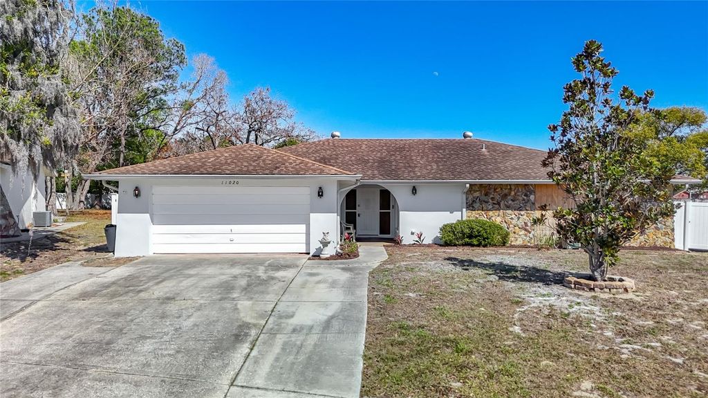 Photo of 11020 Peppertree Lane, Port Richey, FL 34668 (MLS # TB8481249)
