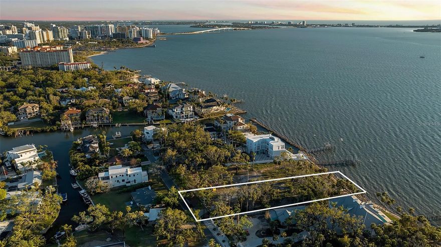 Discover an extraordinary opportunity to own an exclusive bayfront property on .82 acres offering wide open water views and
unparalleled sunsets. Nestled in a prime location near the focal point of Bayfront in Sarasota, this private and expansive 35,754 SqFt
lot provides the perfect canvas to build your dream estate. Boasting a deep site with boatable water access, this property offers the
ideal setting for creating a grand waterfront retreat with 104 feet of bayfront protected by a concrete seawall. The serene
surroundings and panoramic views across the bay deliver a sense of tranquility while remaining just moments from the vibrant energy
of Downtown Sarasota’s cultural and dining scene. Enjoy the luxury of space and privacy with ample room to create a sprawling
estate with resort-style amenities and a private dock to take advantage of the boating opportunities. With its close proximity to
performing arts, dining, world-class beaches, and refined entertainment, this property embodies the best of Sarasota’s waterfront
living. Seller will consider offers including payment in Bitcoin, subject to title and escrow approval. This lot has been newly divided and represents the North parcel. The adjacent South parcel is also available for purchase for $5,500,000, offering a valuable opportunity for expanded ownership or future development.