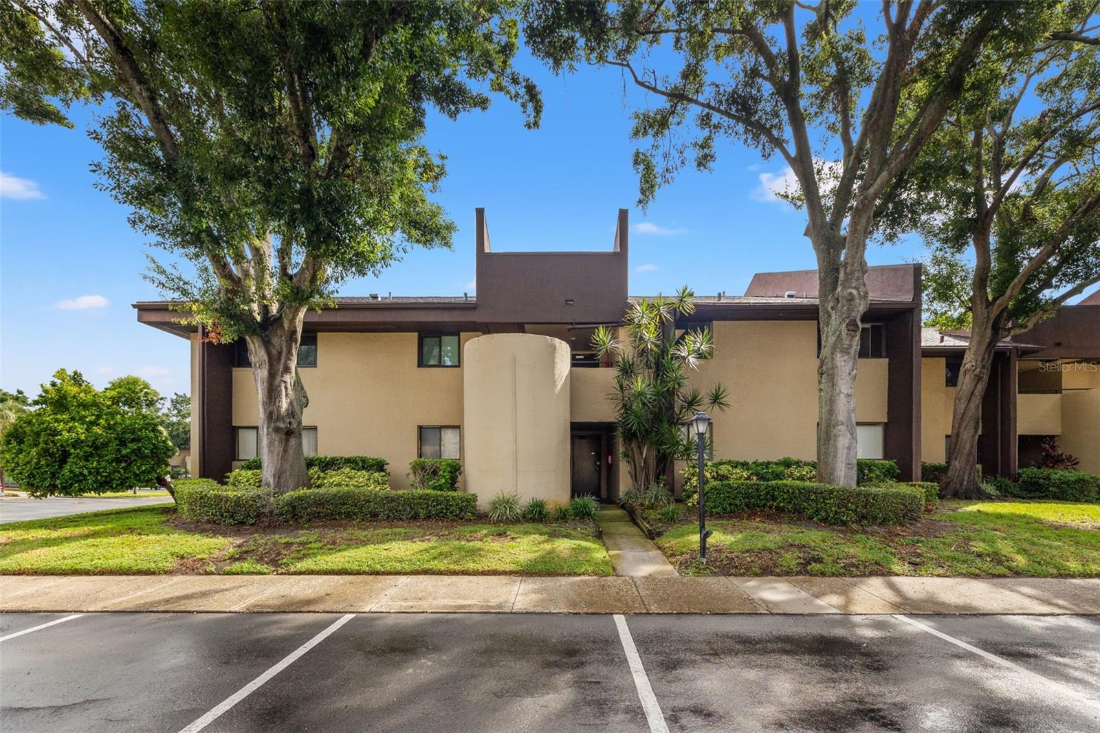 Nestled in the highly sought after Village Lake community, this meticulously maintained 2-bedroom, 2-bath condo offers about 975 square feet of living space and a perfect blend of comfort, style, and convenience. With a designated parking spot directly in front of the home, this beauty is situated on the second floor, this light and airy residence features an open-concept floor plan designed to maximize space and natural light, while showcasing peaceful water views from your own private covered balcony. Step inside to find laminate flooring throughout the main living spaces, creating a seamless flow and contemporary feel. The spacious kitchen is both charming and functional, boasting ceramic tile backsplash, tile & butcher block countertops, generous cabinetry, and ample prep space—ideal for everyday cooking or entertaining guests. The adjacent dining and living areas are flooded with natural light and provides flexible space for relaxation or gatherings, with rear access to beautifully maintained community grounds. The primary suite is a private retreat, offering dual closets, laminate flooring, and a dedicated vanity area leading to the ensuite bath. The second bedroom is generously sized, ideal for guests, a home office, or creative space, with convenient access to the second full bathroom. For added ease, this home includes an in-unit washer and dryer, additional storage, and balcony access that invites you to unwind with tranquil pond views and enjoy Florida’s year-round breezes. Beyond your door, the Village Lake community provides resort-inspired amenities including two sparkling swimming pools, tennis & pickleball courts, scenic walking and biking paths along Roosevelt Blvd, and serene landscaping throughout. Additionally, this community is pet-friendly, and also included in the monthly fees you are provided with discounted internet, water, sewer, trash, exterior maintenance, and monthly pest control, offering a truly low-maintenance lifestyle. Located just minutes from top-rated schools, vibrant shopping centers, local eateries, and major roadways, you’ll enjoy quick access to both Clearwater Beach and an easy commute to the Gandy bridge, St. Pete/Clearwater International Airport and Tampa International Airport as well as downtown St. Petersburg’s cultural scene and entertainment. Whether you’re looking for a full-time residence, a seasonal retreat this beautiful property embodies effortless Florida living in one of the area’s most established and well-kept communities.