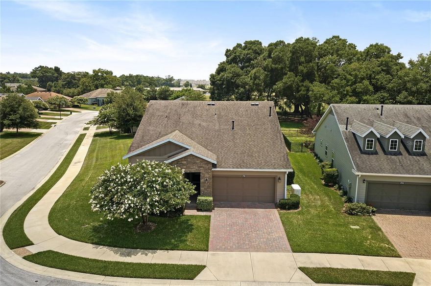Located in the heart of horse country, just a short drive to WEC, HITS, FAST, and more - this Cannes model built by Shea is ready for new owners! Resting on an oversized corner lot backing up to a horse pasture, homes with this kind of view are few and far between. Through the glass front door, you are greeted with upgraded and beautifully designed tile flooring with accent designs, and volume ceilings. To your left you'll find your guest bedroom, currently being used as an office, the possibilities are endless. With extra shelving in the closet, this makes the perfect office, hobby space, or guest room! The front facing windows allow for plenty of sunshine and the guest bathroom is located just outside this room - and is complete with a shower/tub combo and vanity. The den is open but separated - adding to the open concept living area. Some have used this room as a formal dining room while others have used it as a sitting room. Again, the possibilities are endless in this model! The living room flows nicely into your eat in kitchen, great for entertaining. Solid cabinets and tile backsplash beautifully accent your peninsula island and stone counters. Off of the kitchen is the smart space which houses your washer and dryer and has extra cabinets installed for storage. Back into the main living area, you'll find the enclosed and carpeted lanai, which is under air with heat and AC complete with thermal glass windows, and views of the pasture. The master bedroom is generous in size and has beautiful backyard views through large windows! The ensuite bath has a nicely tiled stand up shower and dual sinks in the vanity. The walk-in closet is large enough for all of your personals! This whole house has so many upgrades/features, including but not limited to, new garage door opening system with motion sensing led lighting, water softener system, GENERAC WHOLE HOUSE GENERATOR, window tinting in the lanai as well as south and west sides of the home, and more. There is a hot water booster for the kitchen and master bath which speeds up the delivery of the hot water, as well as the whole house and major appliance surge protection throughout the home. The security system will stay, with exterior cameras and ring doorbell! These owners pulled out all the stops and the upgrades are endless!  Ocala Preserve offers Walking Trails, Lakeside Veranda & Boardwalk, Resort Spa & Fitness Facility, Tennis, Pickleball, and Bocce Facilities, Clubs and Bar, Resort & Lap Pool, Restaurant, and so much more. Call today for your private tour!
