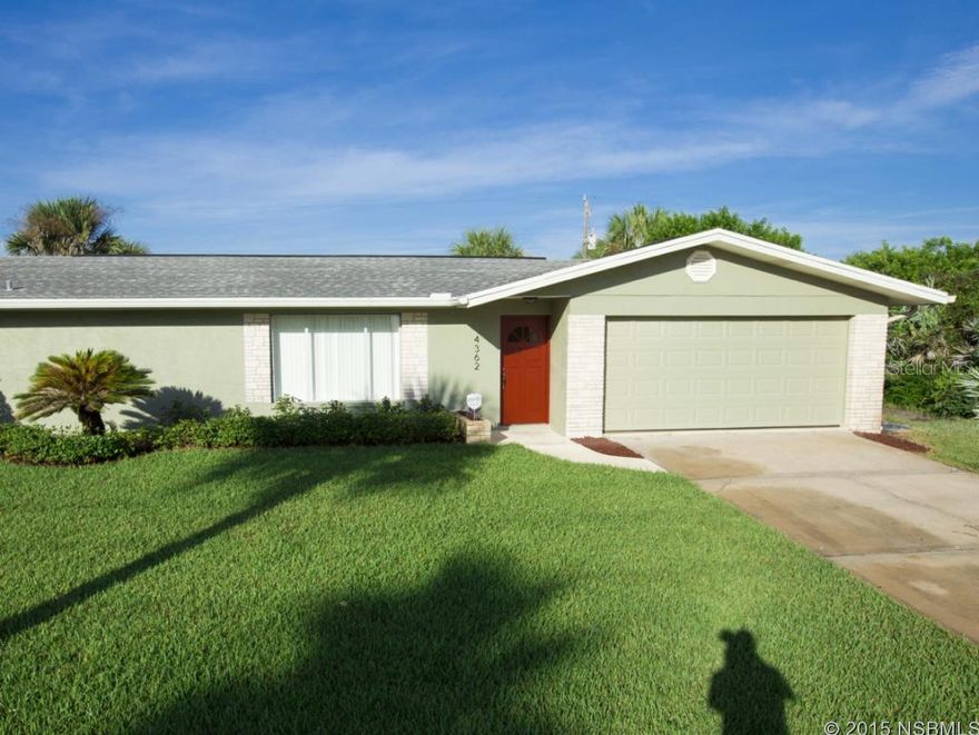 DIRECTLY ACROSS FROM THE BEACH, this 3 BEDROOM/2 BATH beachside home with LARGE SCREENED POOL & is STEPS TO THE BEACH ACCESS!   Light and bright open floorplan with split bedrooms, beautiful 18 x 18 ceramic tile throughout living areas & wood laminate in bedrooms.  The combination living/dining room with separate family room and wood burning fireplace is great for entertaining or to let the family spread out.  Fully equipped kitchen has pass through bar to screened pool area.  Master suite has sliding doors to pool/patio, and master bath has been updated.   Second bedroom also has sliders to pool area.  Convenient pool planned guest bathroom with door from pool/patio area.    Newer roof ,  updated light fixtures & ceiling fans throughout.   New exterior & interior paint, privacy fence, garage opener with exterior keypad, manicured lawn & irrigation system.  Perfect beach home, vacation getaway or investment property. ;Water: City