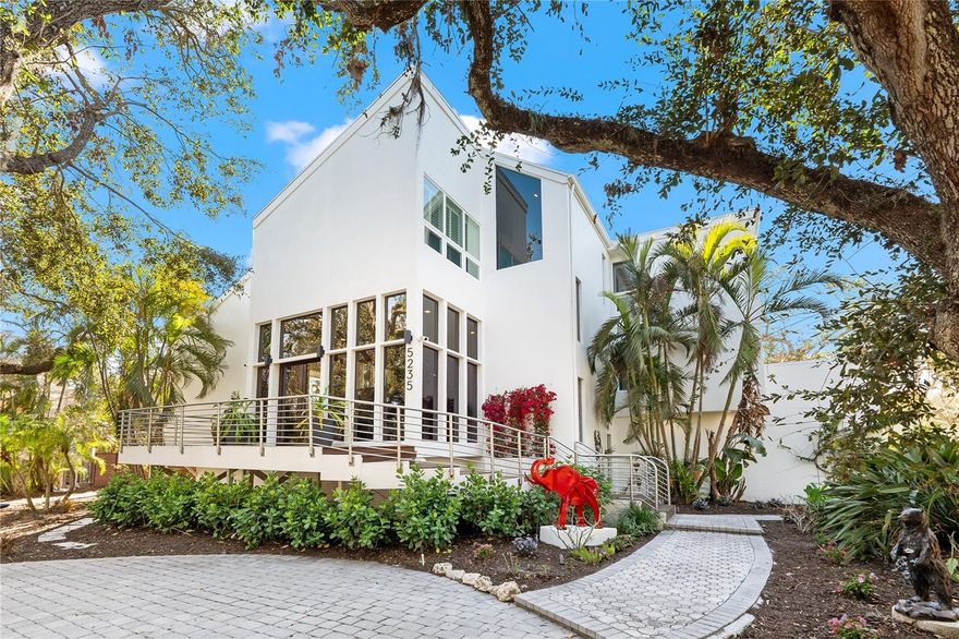 You will absolutely fall in love with this carefully curated masterpiece on Siesta Key! Nestled in the coveted Siesta Cove neighborhood, this stunning, fully renovated home offers a rare blend of old Florida charm and modern luxury. Situated just half a mile from Siesta Beach, this exceptional residence rests on nearly half an acre, adorned with majestic live oak trees, creating a serene and private atmosphere.
Gorgeous IPE decking surrounds the home, seamlessly uniting the indoors with the outdoors and infusing every space with a warm, tropical feel. Dine alfresco or lounge by the pool, shaded by retractable sunshades for ultimate comfort. An impressive array of windows gives the sensation of living among lush, mature foliage—your very own luxury treehouse. Plus, enjoy peace of mind with a brand-new roof installed in 2023!

In addition to the 3,899 square feet of living space, stay active in your private 1,200 sq. ft. gym, located on the bottom, non-conforming level of the home. Take a refreshing swim in the extra-large pool, then unwind in your brand-new sauna for the ultimate relaxation experience. Retreat to the serene, spa-like marble master bathroom—a true sanctuary for rest and rejuvenation. Finally, gather in the spectacular chef’s kitchen to create memorable meals using top-of-the-line Wolf and Sub-Zero appliances.
This multi-level, multidimensional home offers abundant space for grand-scale entertaining while still providing intimate, cozy retreats for quiet moments.
Make sure to click on the video tour to get a better look at this fabulous home!
Please see attached feature sheet for an extensive list of improvements.