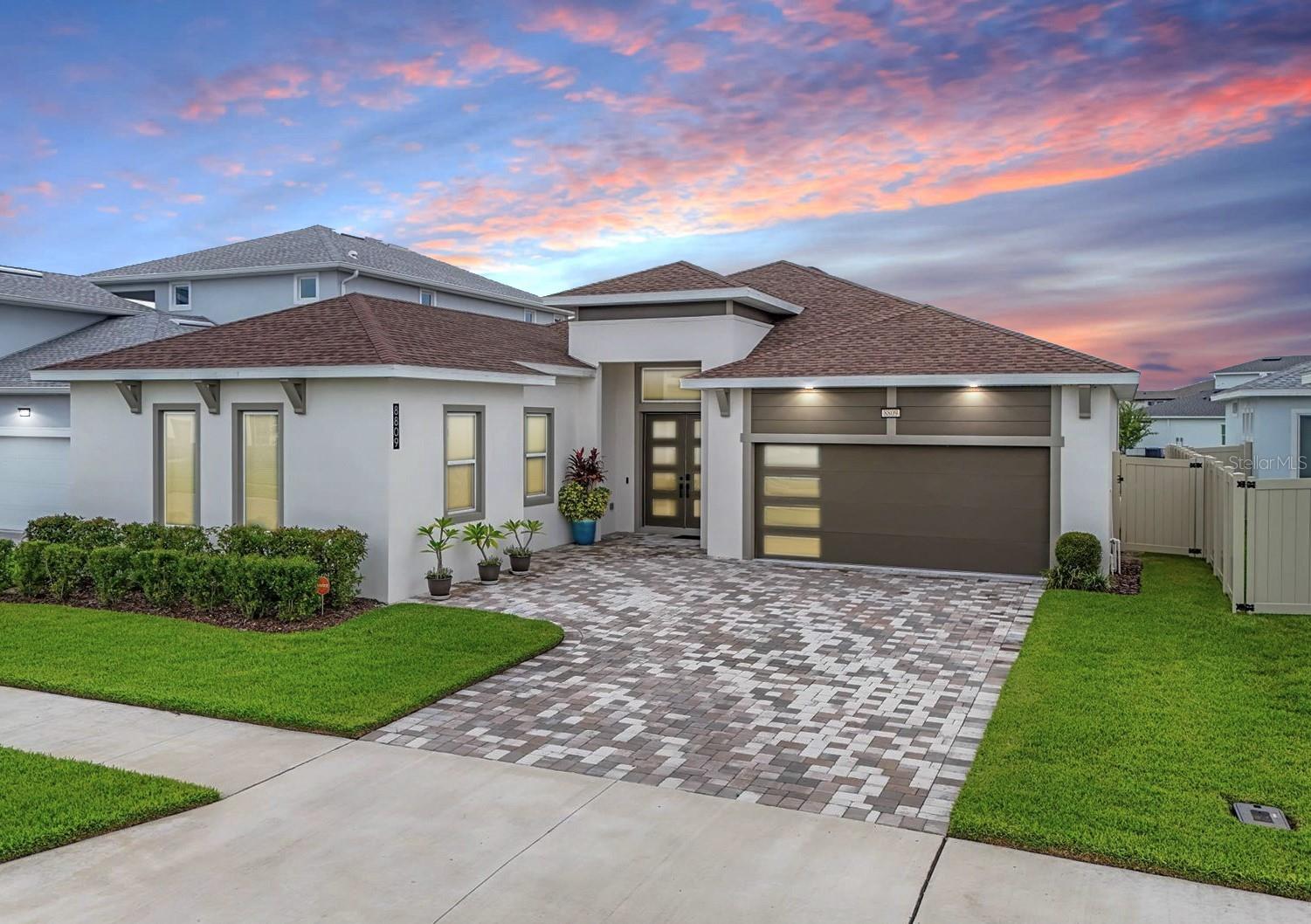 Welcome to this dynamic, upgraded home in the highly sought-after lagoon community of Epperson! This home is a Must See with 3 Bedroom,
Bonus Room, Water View, Screened Lanai, Fenced Yard and upgrades at every turn. From the moment you enter through the double glass doors
into the welcoming foyer, you'll feel the charm and elegance of this stunning property. The home’s expansive open-concept great room is filled
with natural light, offering stunning water views that immediately set the stage for both relaxing and entertaining. The bright, open great room
with surround sound offers a gorgeous water view, setting the perfect stage for both entertaining and everyday relaxation. The chef's kitchen is
a true showstopper, boasting a 5-burner gas stove with a pot filler, farm sink, quartz countertops, and stunning dark blue cabinetry with undercabinet lighting. The massive 12-foot island with a waterfall edge provides ample room for casual bar stool seating, making it perfect for
entertaining or quick breakfasts. You’ll love the additional butler’s pantry and large walk-in pantry, which offers extra storage and prep space. A
sunny eating area overlooking the tranquil water makes every meal a picturesque experience. The remarkable primary suite filled with natural
light, featuring a luxurious Japanese soaking tub, a walk-in closet, dual sinks, and a spacious shower. Two secondary bedrooms share a Jack and
Jill bath with dual sinks and LED lighted mirror for added convenience. This layout offers privacy for family members or guests and makes for
easy, organized living. If you need even more living space, a bonus room can easily be used as a home office, gym, playroom, or hobby space—
the possibilities are endless. The home also offers a convenient half-bath for guests, complete with a chic LED lighted mirror, and a wellappointed laundry room with its own sink and additional storage. Outside, the fenced yard, screened lanai, and breathtaking sunset views over
the pond create the ultimate outdoor retreat. Perfect for entertaining, with gas and plumbing hookups in place to easily add your dream outdoor
kitchen. Upgrades abound, including $50K in builder enhancements, no carpeting—just large-format porcelain tile throughout - for ease of
maintenance, premium high-impact screens on the screened patio. The home is fully equipped for modern living with a propane gas connection
for the cooktop and laundry dryer. Additional highlights include a Nest thermostat and a garage with epoxy-painted floors and two 240-amp
outlets for EV chargers on both sides, making it a future-ready space for electric vehicle owners. This home is located in Epperson, home to the
first 7.5-acre Crystal Clear Lagoon, where you’ll enjoy amenities like a swim-up bar, water slide, paddleboarding, kayaking, and more. Lounge in
a private cabana, take your dog to one of the community’s parks, or explore the miles of biking, walking, and golf cart trails that wind through
the neighborhood. HOA fees cover UltraFi provides fast internet and cable with 175+ channels. Just minutes from the Publix, dining,
shopping, and I-75, this home offers luxury, convenience, and a lifestyle like no other. Don't miss the chance to see it in person!