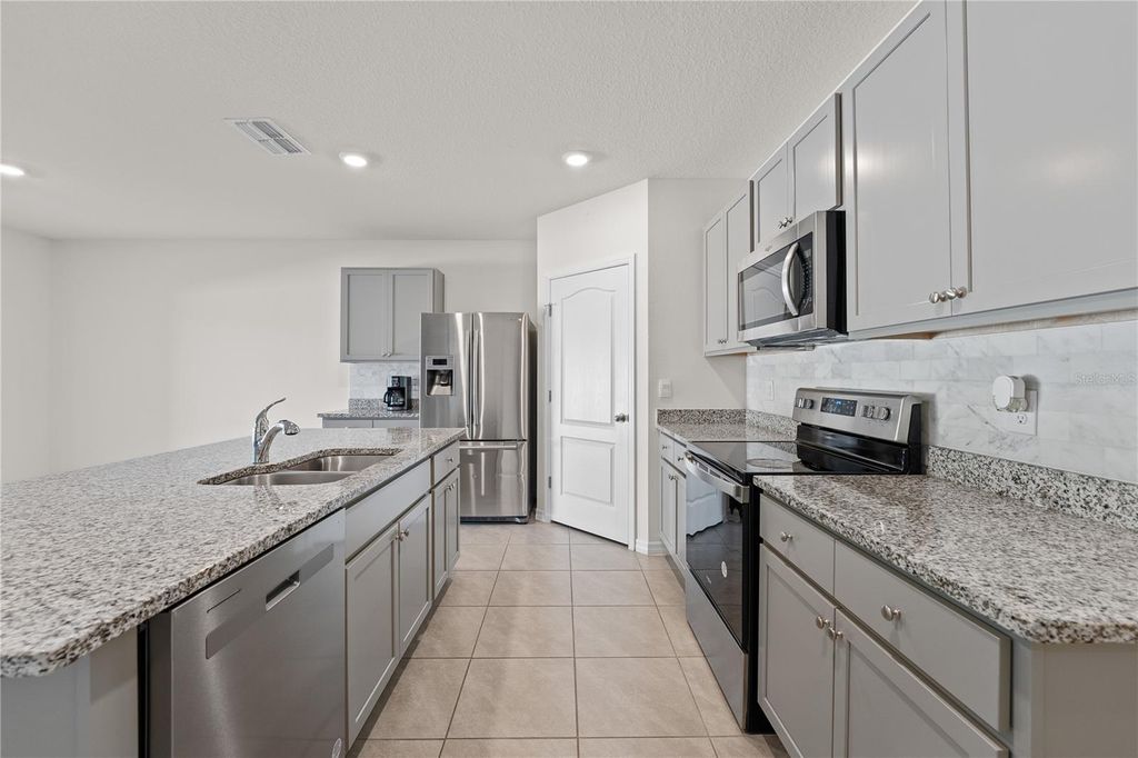 Photo of 571 Tanaro Lane, Haines City, FL 33844 (MLS # S5132139)