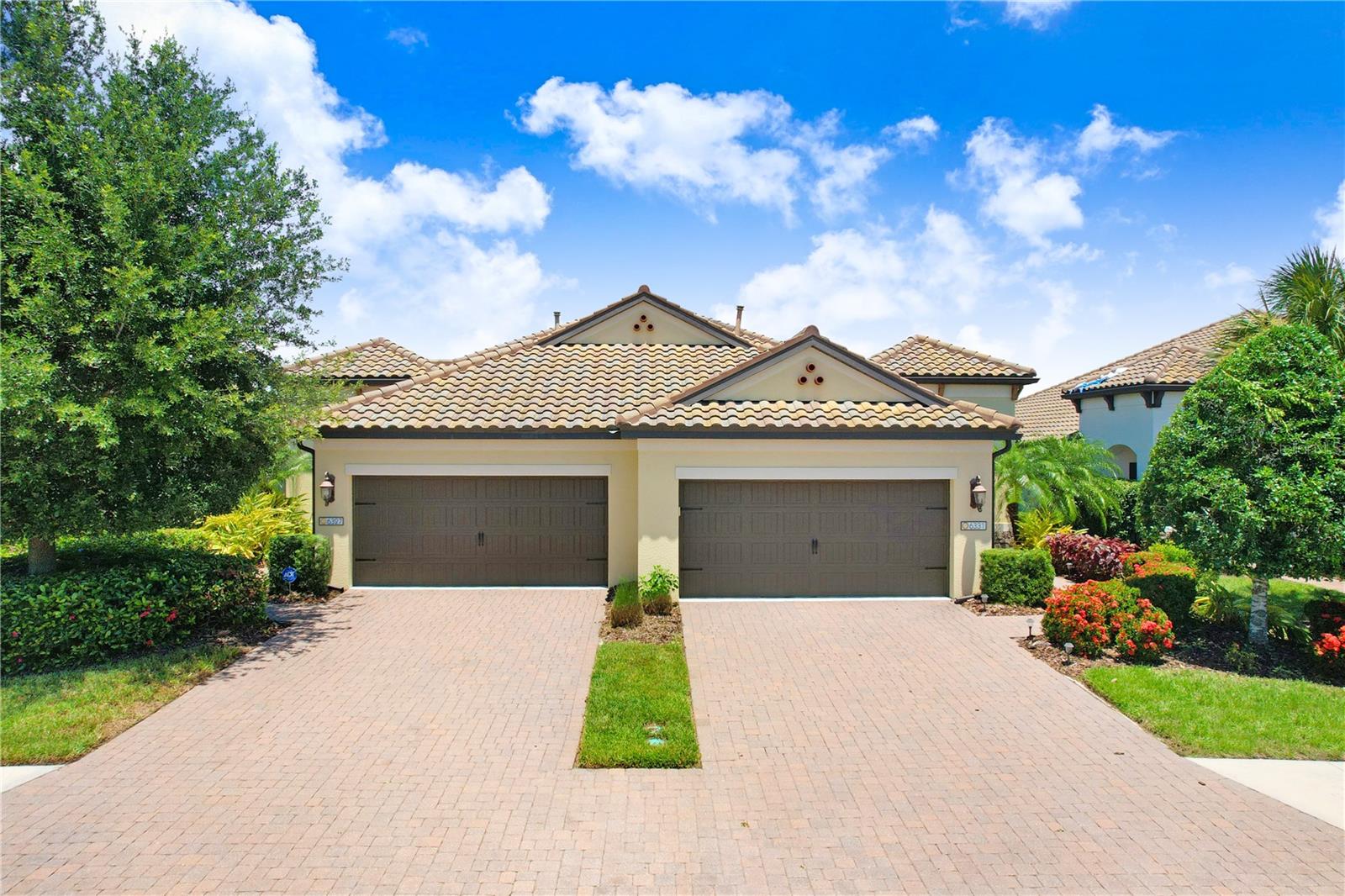 Welcome to the gated Neal Community of Villa Amalfi, where elegance seamlessly blends with convenience in this stunning Crystal Sand Villa. This maintenance-free home boasts 2 bedrooms, 2 bathrooms, and a versatile den currently set up as a formal dining but double doors provide multiple uses, even as a 3rd bedroom. Just under 1,500 sq ft this villa is thoughtfully designed, offering an open airy floorplan that is perfect for entertaining or cozying up with a good book. The first bedroom is located up front with a full bathroom located directly across. The laundry area is next to the bathroom behind bi-fold's with overhead storage, and the washer/dryer will convey. The nicely sized primary suite is tucked in the rear of the home offering amazing water views right from your very own bed...what a way to start your day!!! His & Her closets provide ample storage space and the ensuite is nice & bright with separate vanities, a private water closet and a beautiful walk-in shower. The rear lanai has been extended and once you step out you will see why....serene pond views are calling your name. Villa Amalfi is a small gated boutique community with very friendly & social neighbors. Enjoy the community center, heated pool & spa and outdoor kitchen. Low maintenance fees include; ground maintenance, exterior painting, & roof replacement. Located in a great spot, convenient to Sarasota & Bradenton's Beaches, the University Parkway corridor, 4 miles to i-75 and with tons of great restaurants & shopping nearby you will not miss out!! Upgrades include an extended lanai & screened cage, new bedroom carpet, ceiling fans & light fixtures, and newly painted kitchen cabinets. Several months ago, $15k motorized hurricane shades on the lanai were added for peace of mind. They are fully controlled remotely by an iPad or iPhone or by the hand-held remote. This villa has been meticulously cared for and it shows, get ready to call it HOME!! All furniture is negotiable.