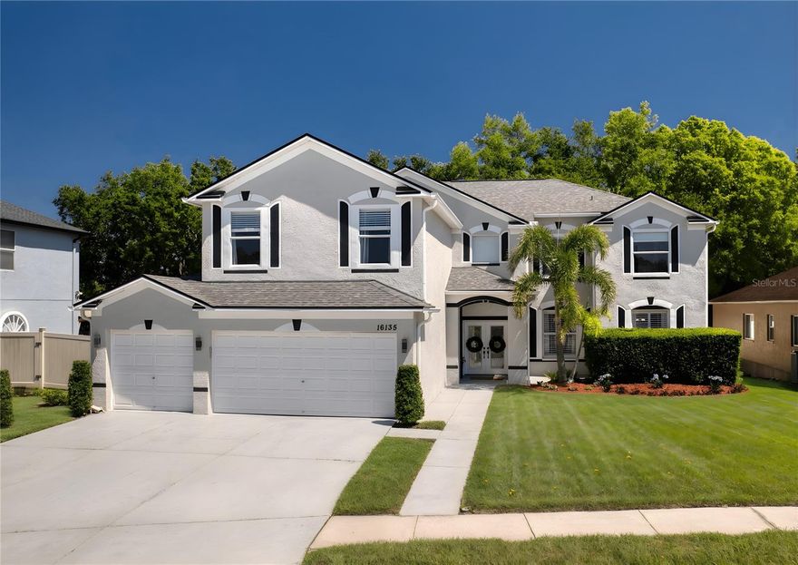 Luxury living awaits in this beautifully updated 5-bedroom, 3-bath executive home in The Eagles, offering 3,852 sq ft, a bonus room, 3-car garage, and a heated saltwater pool with no rear neighbors. Inside, enjoy marble countertops throughout, a designer kitchen with GE black stainless appliances, LVP flooring, plantation shutters, and stylish custom finishes. The spacious primary suite features a sitting area, spa-like bath, and an impressive custom walk-in closet. A full bedroom and bath on the main level provide added flexibility. Step outside to a private oasis with a remodeled pool and expansive covered lanai, perfect for entertaining. Located in a gated golf community with top-rated schools, this move-in-ready home truly has it all.