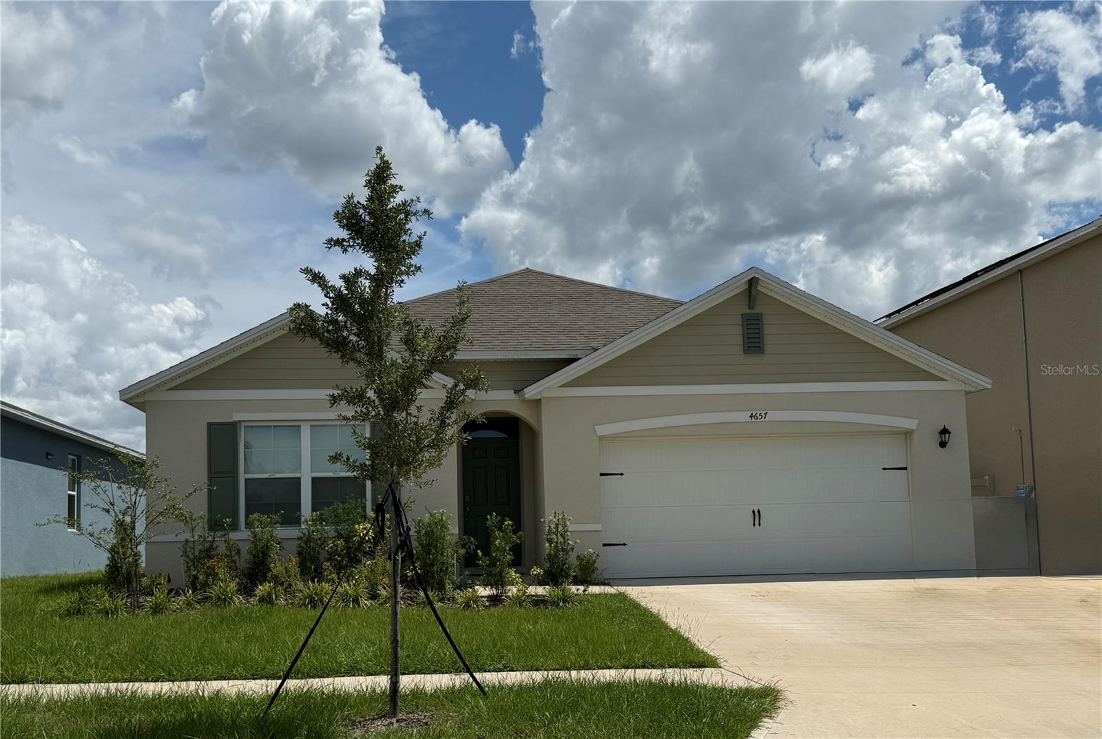 This one story 4 bedroom, 2 bath home with a 2 car garage is almost 1900 sq. ft and is one of DR Horton's most popular floor plan - The Cali. It offers an open layout connecting the living room, dining room, and kitchen but separates the bedrooms for residents space and privacy. The central kitchen features granite counters, stainless-steel appliances, a walk-in pantry and an oversized island with a breakfast bar great for casual meals and entertaining. Tile flooring throughout except the bedrooms. Enjoy the benefits of modern construction with builder's smart home package and structural warranty. Hammock Reserve is a sprawling suburban community boasting a community pool, playground and cabana, and multi purpose play fields.This area offers small town charm with big-city access—Haines City sits between Tampa and Orlando and is minutes from Disney, Lego Land, Lake Lowery for boating, fishing, and kayaking, and the gulf beaches.