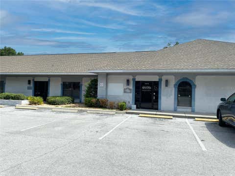 Photo of 918 Rolling Acres Road #102/103, Lady Lake, FL 32159 (MLS # G5114236)