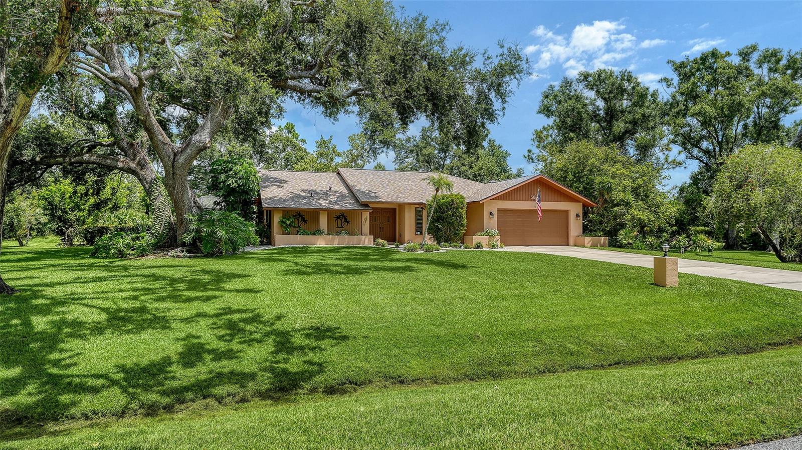 Opportunity awaits in this well-maintained 3BR/2BA pool home on over 1 acre in Sarasota’s tranquil and bucolic Ravenwood community. This property offers timeless appeal, ample space, and a major upgrade: a brand new roof installed in 2025. This home also boasts an effective year built of 2002. With over 2,000 sq ft of single-level living, just minutes away from restaurants, shopping, and medical facilities, this home features split plan bedrooms, cathedral ceilings, tile floors, a formal dining room, and a bonus room which is a perfect office/den off of the spacious foyer with sliding doors leading to the screened lanai. The updated kitchen includes granite countertops, a breakfast bar, a pass thru window to the lanai, and opens to a spacious living/great room with a cozy wood burning fireplace. Enjoy seamless indoor-outdoor living with a large caged screened in ground pool, covered lanai, and lush landscaping featuring mature oaks, palms, and a mango tree. Additional highlights include a jacuzzi tub and separate shower in the primary bathroom, walk-in closets, an indoor laundry room with a washer, dryer, sink and cabinets, an in ground sprinkler system, an oversized 2-car garage with workbench area, a long spacious private driveway, and a spacious rear storage shed built in 2009. The pool area is gracious and private, and the yard is lush and verdant. Tucked away in a highly sought after subdivision with low HOA fees, this property delivers Florida living at its best—spacious, move-in ready, it's in a Flood Zone X, and minutes from UTC, I-75, downtown Sarasota, and top beaches.