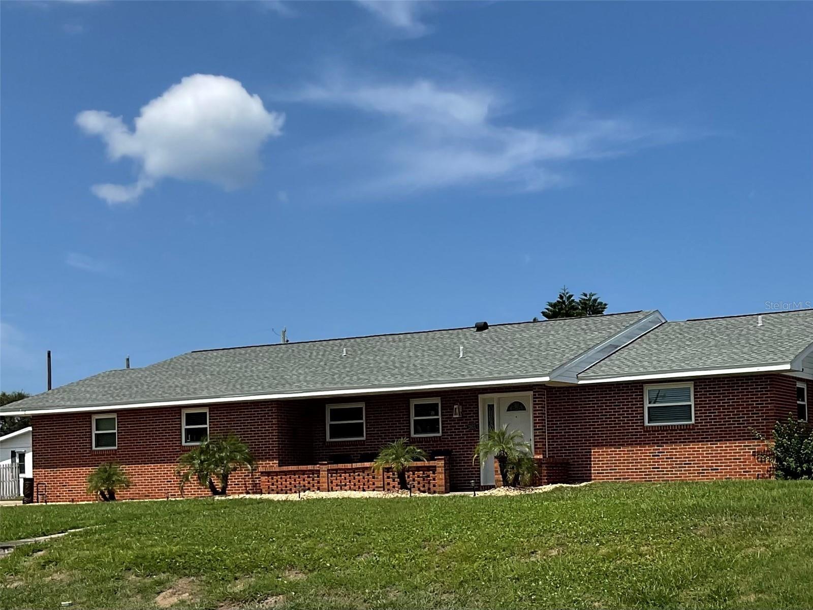 Solid, stylish, and steps from the shore—this 3BR/2BA brick ranch sits high on a dune, just 2 blocks from the iconic Daytona Beach. Set on a prized corner lot, the home boasts a new 30-year roof (2022), impact windows (2024), Irrigation System (2025) and luxury vinyl plank floors (2023). Fresh paint, walk-in closets, new doors add a crisp, modern finish. The kitchen shines with new appliances and garbage disposal. New Dade County-rated siding and a hurricane-rated back door (2025) ensure peace of mind. Enjoy privacy in your fenced backyard with two gates.
