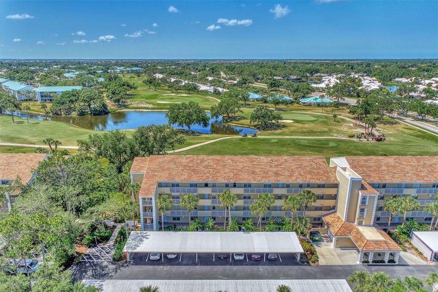 Appealing two bedroom, two bath, penthouse level condo, with golf course and water views, in the Eighth Fairway at Plantation Golf and Country Club. Your condo overlooks the eighth and ninth holes of the Bobcat Course. It features cathedral ceilings in your living room and dining room that make it more light, bright and open than it already is. There is a combination living room and dining room with sliders out the living room to your lanai and beautiful views. The kitchen has wood cabinets, breakfast bar and large closet pantry. The master bedroom has these beautiful views too and the master bath has two built-in closets and a laundry closet. The condo is being sold furnished. The AC system was replaced in 2016 and the water heater was replaced in 2017. The roof was replaced in 2020 for the building and the exterior was painted in 2020 as well. The community offers a heated pool and clubhouse and has an onsite maintenance person. Membership is optional to this outstanding 36 hole championship course. Come see this great buy today!