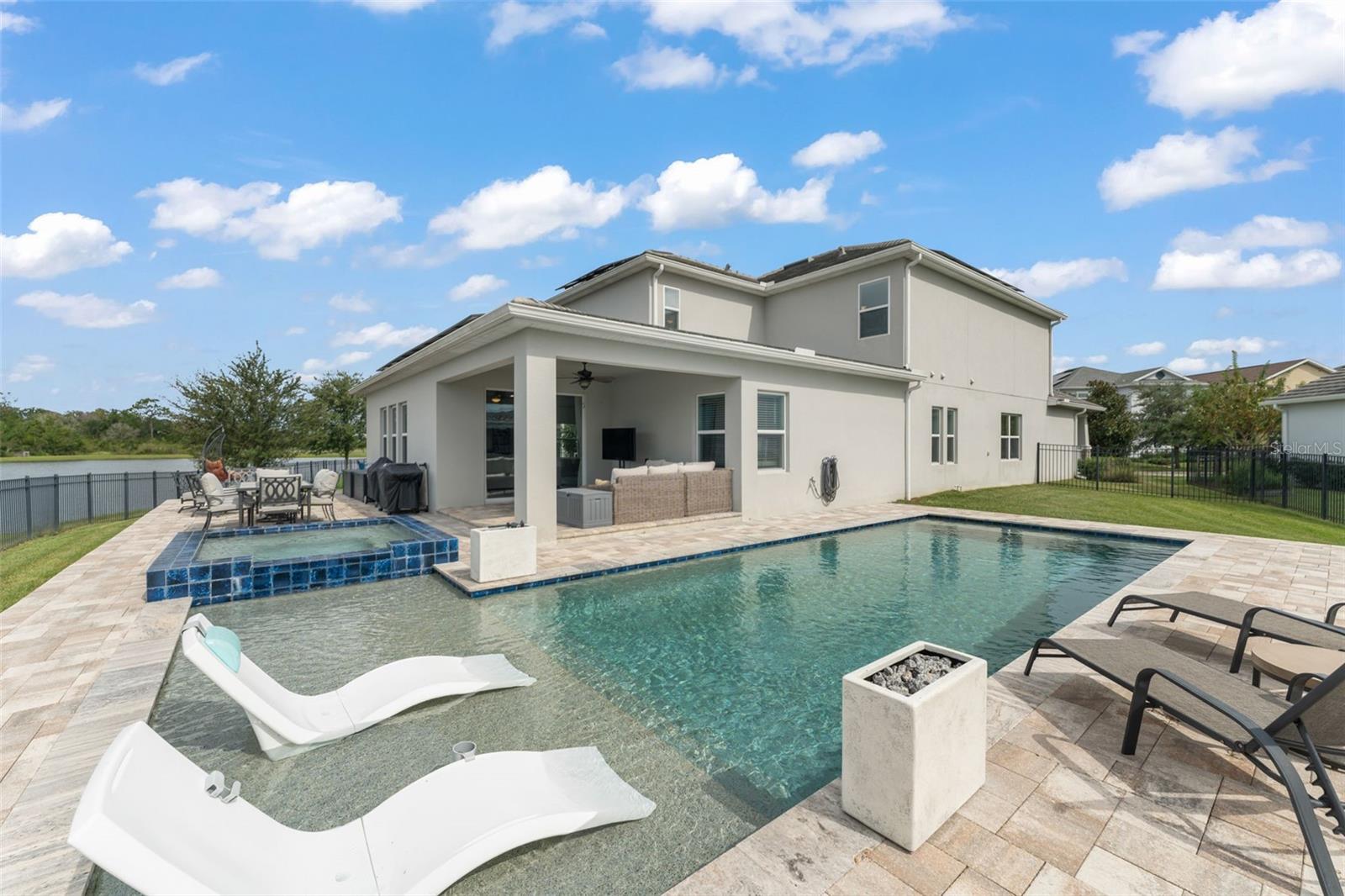 Stunning NEXT GENERATION WATERFRONT POOL HOME overlooking CONSERVATION in the highly desirable STOREY PARK COMMUNITY in LAKE NONA! Built in 2020, this CONTEMPORARY 5-BEDROOM, 3.5-BATHROOM two-story POOL home showcases the sought-after INDEPENDENCE II floorplan with 3,895 square feet of refined living space, combining thoughtful design, modern efficiency, & resort style living, with a rare 3 CAR tandem GARAGE and a mother-in-law/ guest suite with a separate entrance, bedroom, living area, kitchenette, and washer and dryer. The main home features an OPEN CONCEPT floorplan integrating the kitchen with the living and dining areas where large windows draw in natural light and capture the BREATHTAKING POND AND CONSERVATION VIEWS.
The CHEF-INSPIRED KITCHEN is designed for both style and function, complete with a walk-in pantry, an oversized island, QUARTZ COUNTERTOPS, STAINLESS-STEEL APPLIANCES, subway tile backsplash, and a REVERSE-OSMOSIS WATER FILTRATION SYSTEM.
Upstairs, the spacious primary bedroom feels like a sanctuary with an ensuite bath with dual sinks, a bathtub and a walk-in shower. The 3 other bedrooms are generous sized while the LOFT offers flexibility for a HOME OFFICE, PLAY AREA, or MEDIA ROOM. The laundry room is also located on the second floor for convenience.
Step outside to your fenced-in BACKYARD OASIS with a COVERED LANAI and a CUSTOM DESIGNED SALTWATER POOL with a sunshelf and a SPA, and plenty of green space for pets or outdoor play.
Residents of STOREY PARK enjoy world-class AMENITIES including a CLUBHOUSE, RESORT-STYLE POOL, FITNESS CENTER, TENNIS COURTS, DOG PARKS, NATURE TRAILS, PLAYGROUNDS, and YEAR-ROUND COMMUNITY EVENTS.
Situated in a prime location amidst the VIBRANT LAKE NONA community, within minutes from THE MEDICAL CITY, and with easy access to Lake Nona’s TOP RATED SCHOOLS and numerous shopping, dining and entertainment options, and all that Central Florida has to offer, this home is NOT TO MISS!
**This house comes with a REDUCED RATE through the seller's preferred lender. This is a lender-paid rate buydown that reduces the buyer's interest rate and monthly payment.**