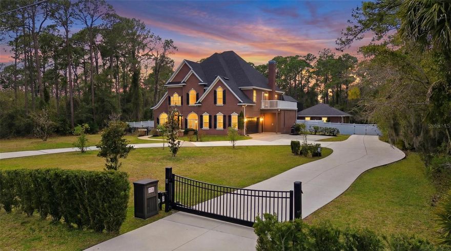 An exceptional custom estate set on nearly 2 secluded acres, offering privacy, sophistication, and resort-style living. A grand foyer with bespoke woodwork and a statement staircase welcomes you into a home designed for both elegance and comfort.
The chef’s kitchen is a showpiece, featuring a hidden walk-in pantry, gas cooktop, double ovens, dual sinks, and rich granite surfaces throughout. The owner’s retreat delivers a true spa experience with an oversized walk-in shower, Jacuzzi soaking tub, and expansive walk-in closets.
Step outside to your private oasis — a heated pool and spa surrounded by serene grounds, enhanced by a new electronic gate and fencing for ultimate exclusivity. Adding extraordinary value, a newly built luxury 1-bedroom pool home (completed within the last year) offers ideal accommodations for guests, multigenerational living, or executive-style rental potential.
Enjoy seasonal balcony views of the nearby St. Johns River and a prime location with effortless access to I-4, just minutes to Orlando and Daytona Beach.
Recent updates include a 2023 roof, newer AC, and water heater. A solid poured concrete safe room provides added peace of mind.
Impeccably maintained, move-in ready, and designed for refined Florida living.
Sold As-Is. Measurements approximate; buyer to verify.