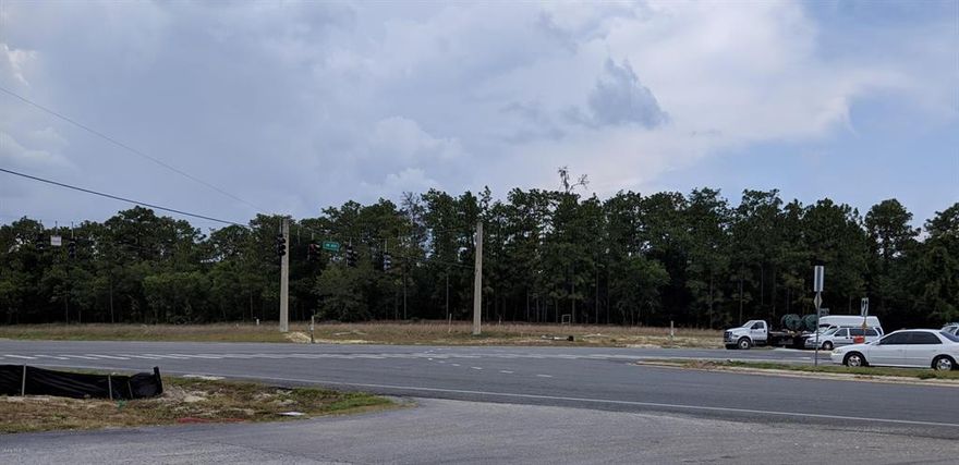 Located at the busy corner of Highway 200 SW and Highway 484 SW in Ocala. This Commercial property is zoned B-4 and consists of 10.68 acres at a prime location. Controlled intersection 4 lane Highway with traffic light. Over 30K VPD road traffic gives the location a significant exposure for business. Situated just Southwest of Ocala and Northeast of Dunnellon just minutes away from the Citrus County line. it has easy access to I-75 and is in the middle of a Major Business growth corridor. Highway frontage of 1406 LF on Highway Intersection corner with 614 Ft deep and 1182 LF back line. Across from Walmart and Bealls shopping complex and Multiple chain Restaurants as well as many Medical Facilities.