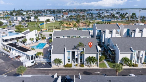 Photo of 230 Medallion Boulevard #F, Madeira Beach, FL 33708 (MLS # TB8545530)