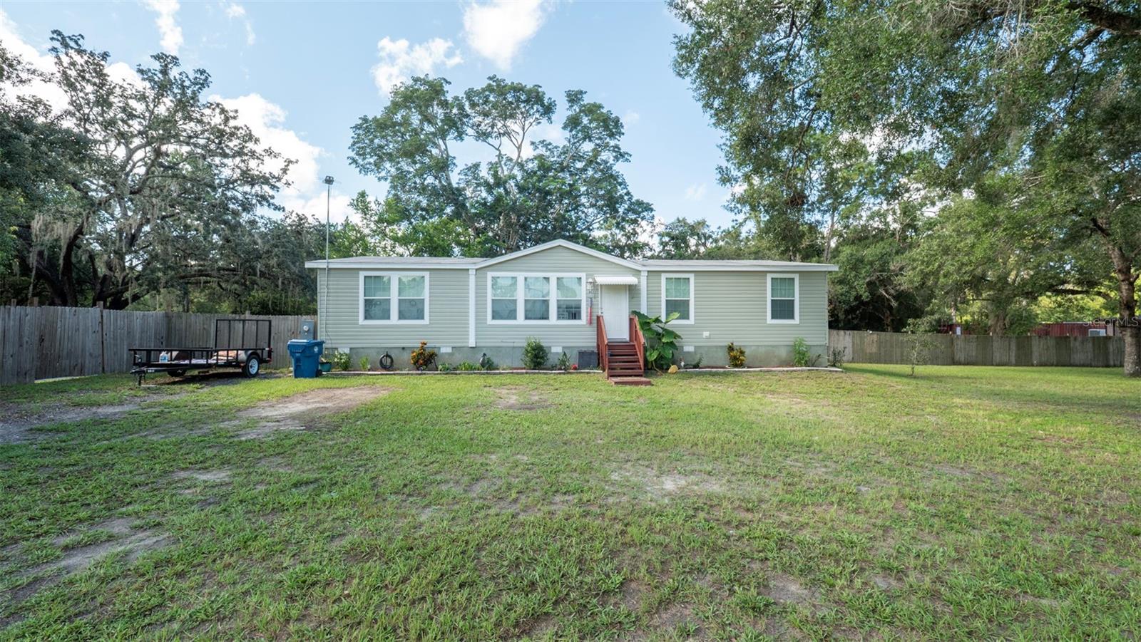 Welcome to your dream home in beautiful Brooksville, FL! This stunning modular home boasts 4 bedrooms and 2 bathrooms, perfect for a growing family or those who love to entertain. With 1736 square feet of living space, there is plenty of room for everyone to spread out and relax. The home features gorgeous vinyl plank flooring throughout, adding a touch of elegance to the space. The fully fenced yard provides privacy and security, making it the ideal spot for children and pets to play. Located in a peaceful neighborhood, you can enjoy the tranquility of small-town living while still being close to all the amenities you need. Don't miss your chance to own this charming home in a desirable location. Schedule a showing today and make this house your forever home!