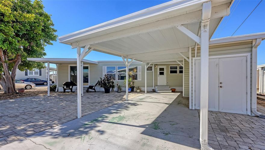 Step into this beautifully updated 2-bedroom, 1.5-bath double-wide home perfectly situated on an oversized corner lot in the highly sought-after 55+ Trailer Estates community.

Inside, you’ll love the open-concept layout connecting the living, dining, and kitchen spaces—ideal for relaxing or entertaining. The kitchen features a convenient breakfast bar, while the spacious primary bedroom easily fits a king-sized bed and offers abundant storage with built-in drawers, ample closets, and an en suite half bath.

Beautiful 3/4" real hickory wood flooring flows throughout the kitchen, living room, hallway, and both bedrooms. The home also includes two sheds—one with laundry and another for a golf cart or workshop.

Major updates include newer windows, roof, A/C (new in 2025), plumbing, and water heater, plus a new vapor barrier and WDO tenting completed in 2021. And best of all—you own the land!

For boating enthusiasts, the community marina provides direct access to Sarasota Bay. Trailer Estates offers an exceptional array of amenities, including a heated pool, hot tub, fitness center, wood shop, and endless activities like pickleball, shuffleboard, bocce, kayaking, horseshoes, and community dances. There’s even a U.S. Post Office on site!

Perfectly located—just 10 minutes to SRQ Airport and close to shopping, dining, and arts.