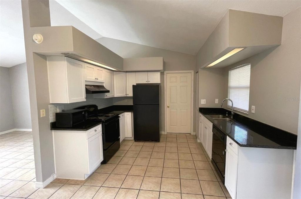 Photo of 305 Mormanno Way, Kissimmee, FL 34758 (MLS # TB8465083)