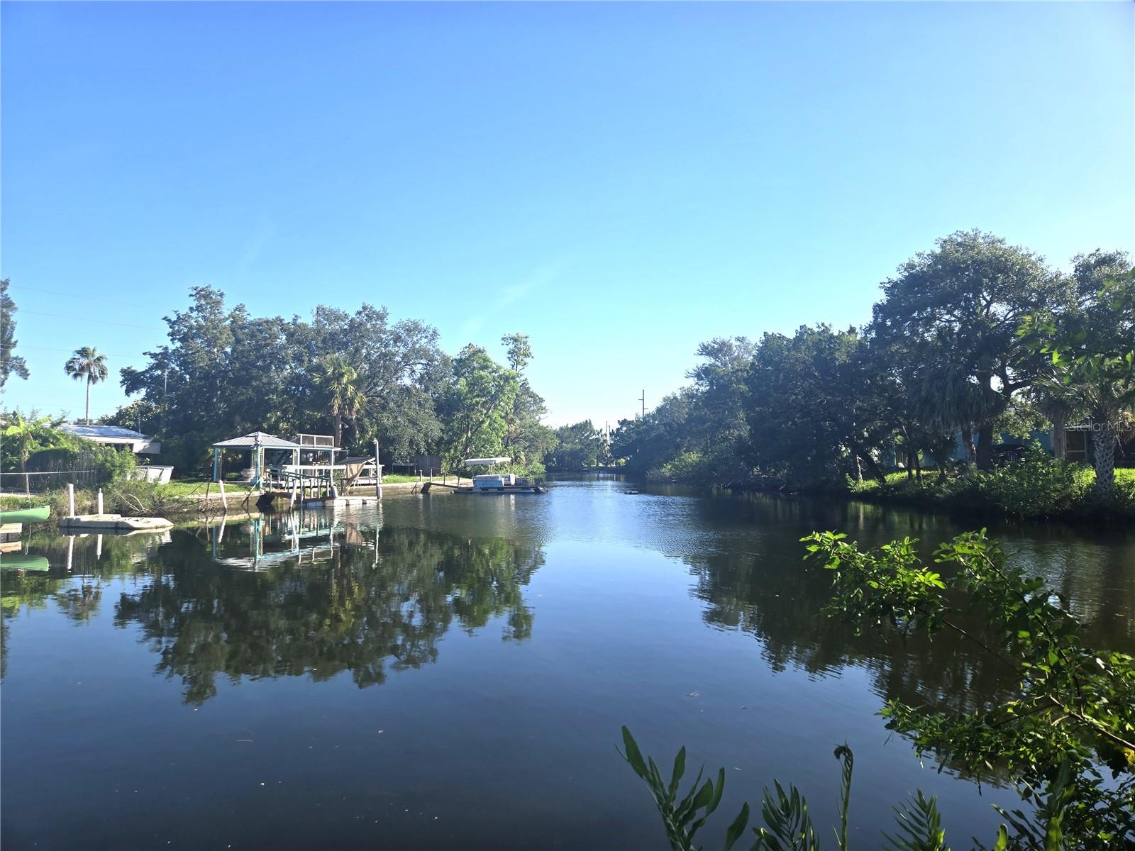 Discover the perfect place to build your coastal dream retreat with this canal-front parcel of land located on a dead-end street in Hudson, Florida. Boasting 80 feet of canal frontage, this rare property offers direct access to the Gulf of Mexico—ideal for boating, kayaking, fishing, or simply enjoying Florida’s laid-back lifestyle. This lot is zoned for manufactured homes and is located in a residential neighborhood with no HOA or deed restrictions. With water and sewer already connected, it’s ready for you to bring your boat, toys, and vision to life. Conveniently located near beaches, waterfront restaurants, shopping, and US-19, this parcel is a true gem on Florida’s Nature Coast. Whether you’re planning to build a full-time residence, a seasonal getaway, or a smart investment property, this is your chance to own a slice of waterfront paradise. Live where others vacation—make every day feel like a getaway.