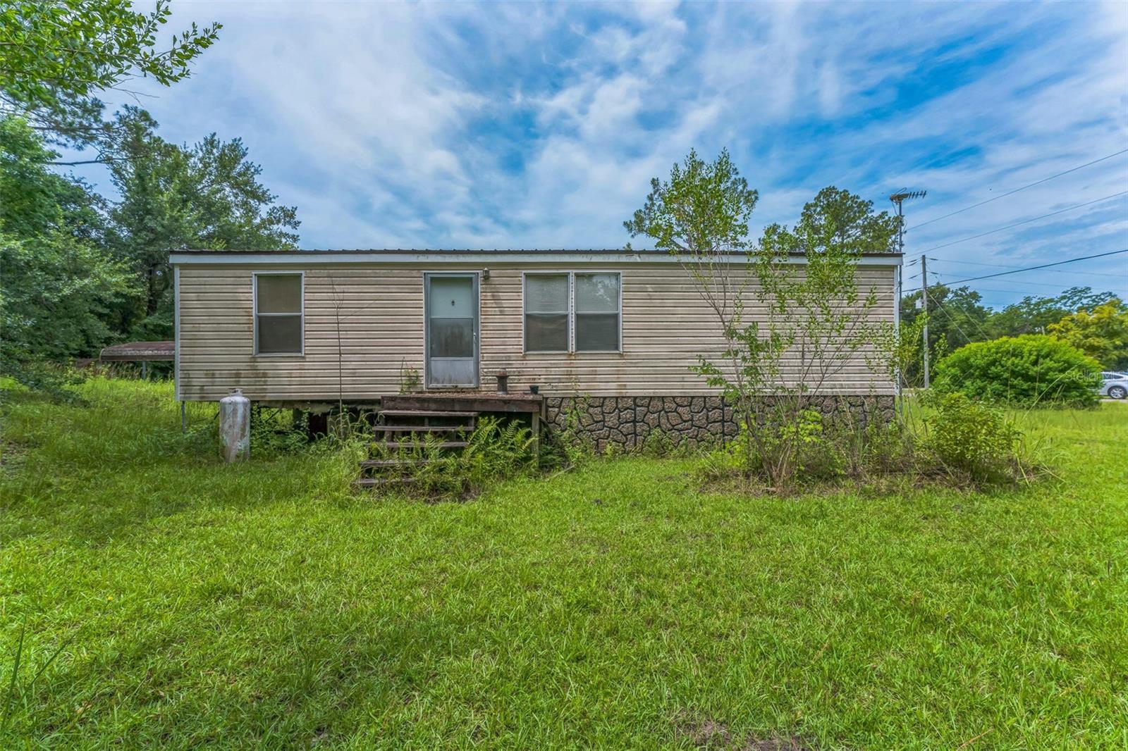 Discover this charming mobile home in Wewahitchka, FL, has a comfortable and inviting living space. Situated on Searcy St, this home features a spacious layout with ample natural light throughout. Enjoy the convenience of a well-equipped kitchen, cozy bedrooms, and a welcoming living area. The property includes outdoor space appropriate for relaxation and entertainment. Experience the tranquility of this location while being close to local amenities. Don't miss this opportunity!