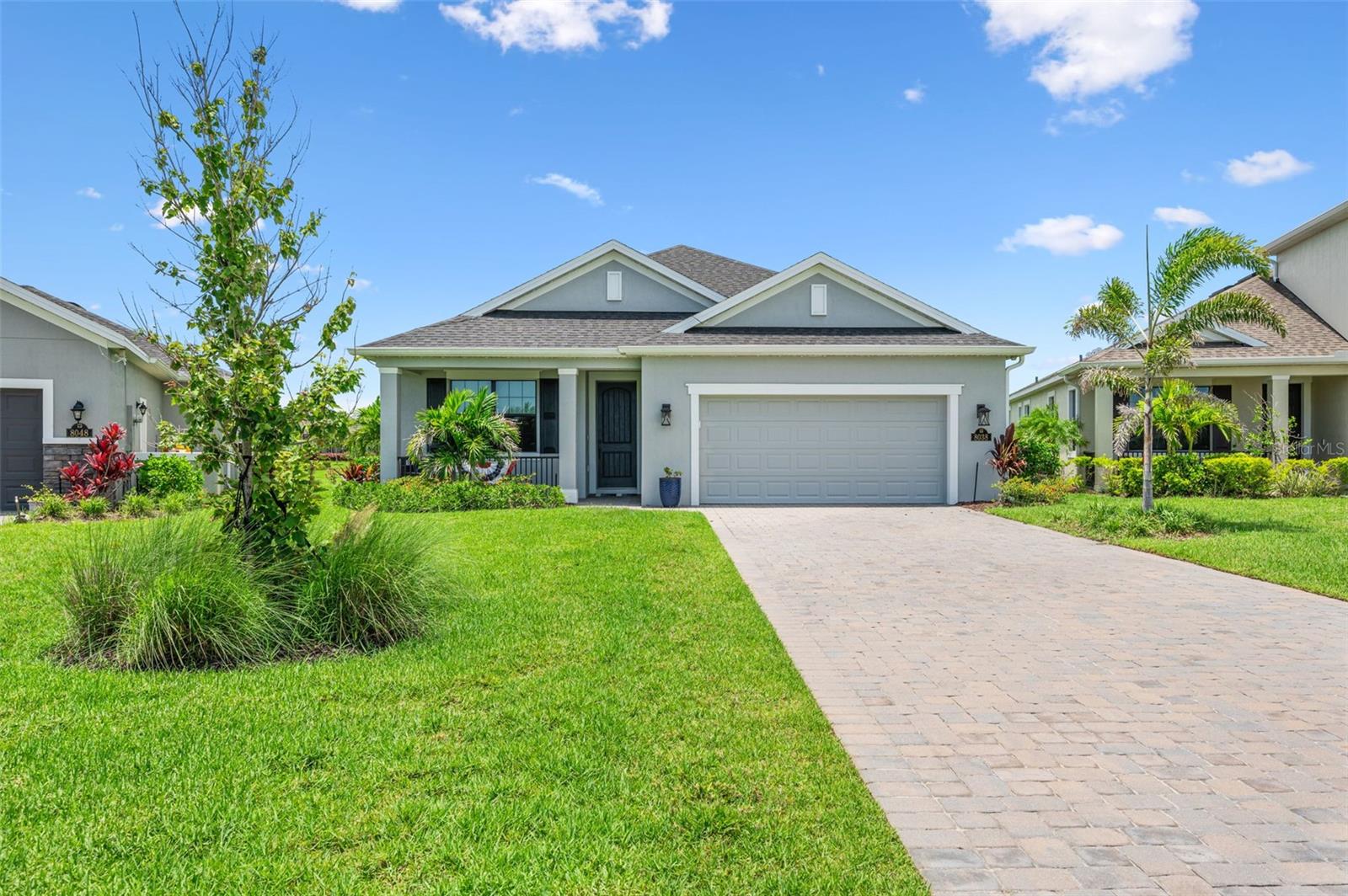 Lawn care is included! Welcome to this absolutely stunning 2022-built home located in the heart of Viera, where luxury, smart technology, and thoughtful upgrades come together in perfect harmony. From the moment you arrive, you'll be impressed by the massive 118.5-foot-long driveway—wide enough to comfortably accommodate up to 10 vehicles—offering both convenience and curb appeal. Step inside to discover sleek tile flooring throughout, soaring taller doors, and premium LG gas appliances in a modern kitchen built for both beauty and performance. Surround sound ceiling speakers elevate the living experience, while custom Roman blackout blinds add both elegance and functionality. Every detail has been carefully considered, from the hurricane impact windows on the front of the home and shutters for the rest, to the tankless hot water heater and energy-efficient LED lighting professionally wired around the exterior. Even the trees are tastefully illuminated, creating a stunning ambiance at night. This Google smart home offers seamless automation, with extensive upgrades made from the start. Enjoy peace of mind and comfort with every modern convenience at your fingertips. One of the standout features of this home is the expansive screened-in back deck, featuring a soaring 10-foot cage and spanning the full width of the house. It's the perfect space to relax or entertain while overlooking lush green space with serene water views in the distance. Lawn care is included in the HOA, so you can spend more time enjoying all the exclusive amenities Addison Village has to offer resort-style pools, clubhouse, fitness center, tennis, pickleball, and more. This home truly checks every box schedule your private showing today and experience the best of Viera living!