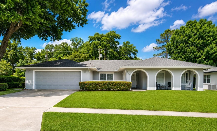 One or more photo(s) has been virtually staged. Beautifully remodeled Maitland home offering a fresh, modern feel throughout. This move-in ready property features an inviting front elevation with charming arched entryways, a spacious driveway, and a well-maintained lawn. Inside, you will find bright, open living areas with wood-look tile flooring, neutral paint, crown molding, updated lighting, and a clean contemporary design. The bedrooms are spacious and filled with natural light, with updated ceiling fans and generous closet space. The bathrooms have been tastefully renovated with modern finishes, including marble-look shower tile, pebble-style shower flooring, matte black fixtures, and updated vanities. Enjoy the convenience of a functional layout, a two-car garage, and a desirable Maitland location near shopping, dining, schools, major roadways, and area amenities. This home is ready for its next owner, schedule your showing today!