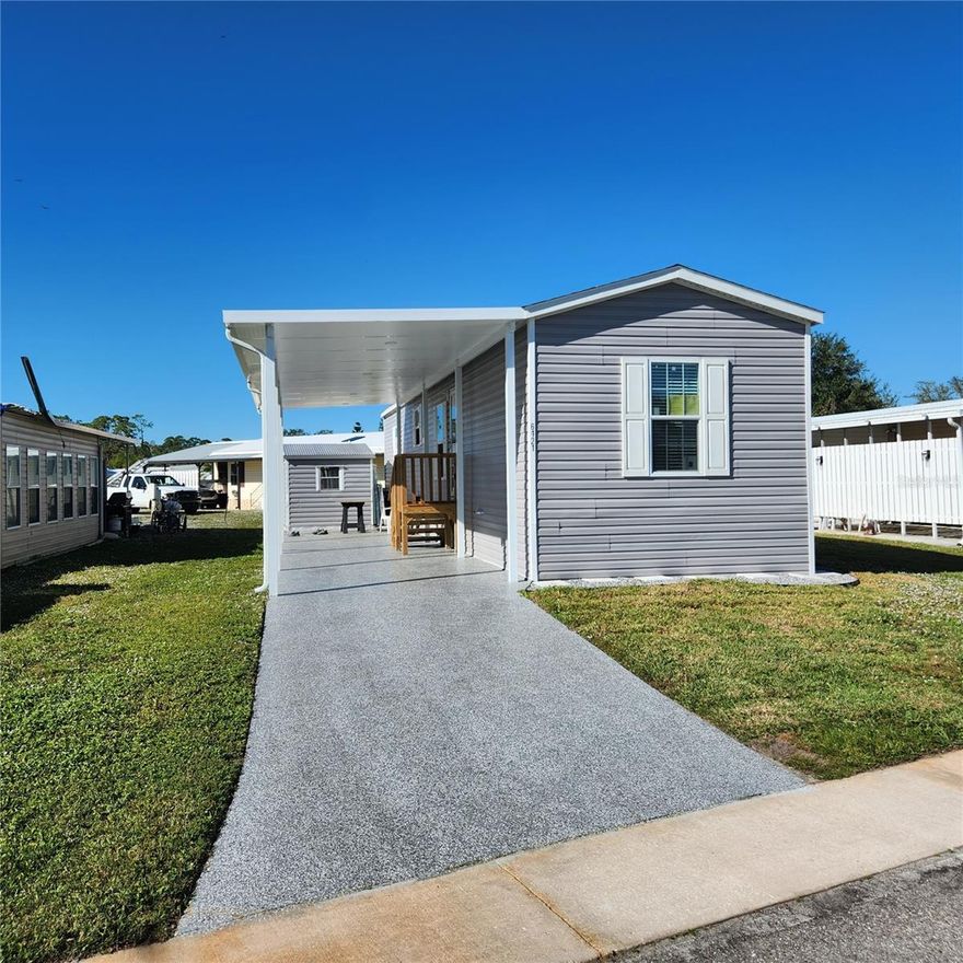 NEW CONSTRUCTION SINGLE WIDE WITH CARPORT IN HOLIDAY PARK!! Beautiful FURNISHED home waiting for you!! Wonderful community with only the lowest HOA fees -$195 A MONTH for the most amenities--GATED 55+ Community with two swimming pools, tennis and pickle ball courts, clubhouse, horseshoes and more all conveniently located to North Port's shopping centers and down the road from the West Villages and Braves Train Stadium. 40X12 CARPORT!!