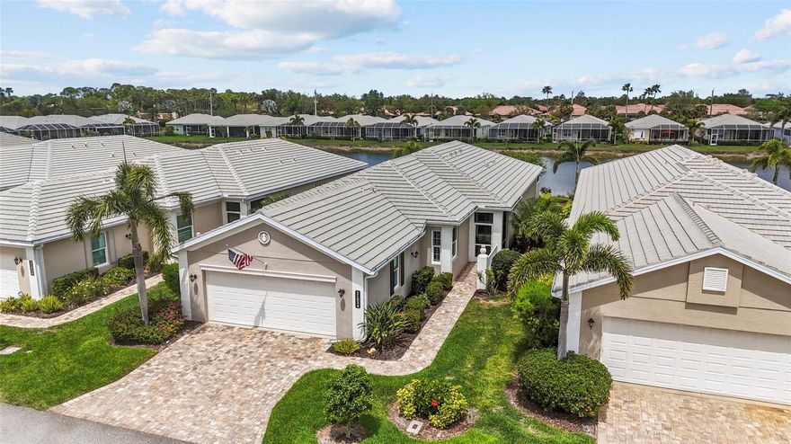 Enjoy the ease of maintenance-free living in this beautifully upgraded patio home in St. Andrews East at The Plantation Golf & Country Club, where exterior care is fully handled so you can focus on enjoying the Florida lifestyle. The association covers exterior insurance from the drywall out, including wind coverage, along with roof reserves, exterior painting, lawn care, pest control, termite prevention, two community pools, a resident-run clubhouse, and full community management—offering true peace of mind with no CDD fee.

This thoughtfully designed home is filled with upgrades and architectural detail, including crown molding, tray ceilings, and elegant arches and columns that define the dining and living spaces within the open floor plan. Expansive pocketing sliding glass doors seamlessly blend indoor and outdoor living, opening to an oversized lanai with both covered and open areas—perfect for enjoying year-round lake views and Florida’s beautiful weather. Plantation shutters are featured throughout, while the primary suite showcases an electric window shade to fully capture the tranquil lake backdrop.

The spacious kitchen is the heart of the home, offering an abundance of cream-colored cabinetry, granite countertops, a center island, stainless steel appliances including an induction cooktop and double wall ovens, a breakfast bar, and a charming eat-in nook framed by a bay window. The oversized pantry features custom wood shelving for exceptional storage.

The primary suite is a private retreat with peaceful lake views, two walk-in closets with custom organizers, dual sinks, and a walk-in shower. A generously sized den offers flexibility as a home office or additional guest space, while the guest suite is tucked away with its own private bath and walk-in closet for added privacy. A convenient half bath adds functionality for guests, making this home as practical as it is beautiful.

Additional features include a whole-house central vacuum system, water softener, oversized garage, and a new water heater in 2024. Impact windows and clear shutters for the sliding glass doors make this home storm-ready with ease.

Optional membership to The Plantation Golf & Country Club enhances the lifestyle even further, offering access to two 18-hole championship golf courses, 13 Har-Tru tennis courts, six pickleball courts, bocce ball, a fitness center, Jr. Olympic pool, and exceptional dining and social events.

Perfectly located just minutes from Gulf beaches, shopping, dining, Wellen Park Downtown, the Atlanta Braves Spring Training Stadium, and easy access to I-75, this home is simply perfect and delivers the very best of Florida living.