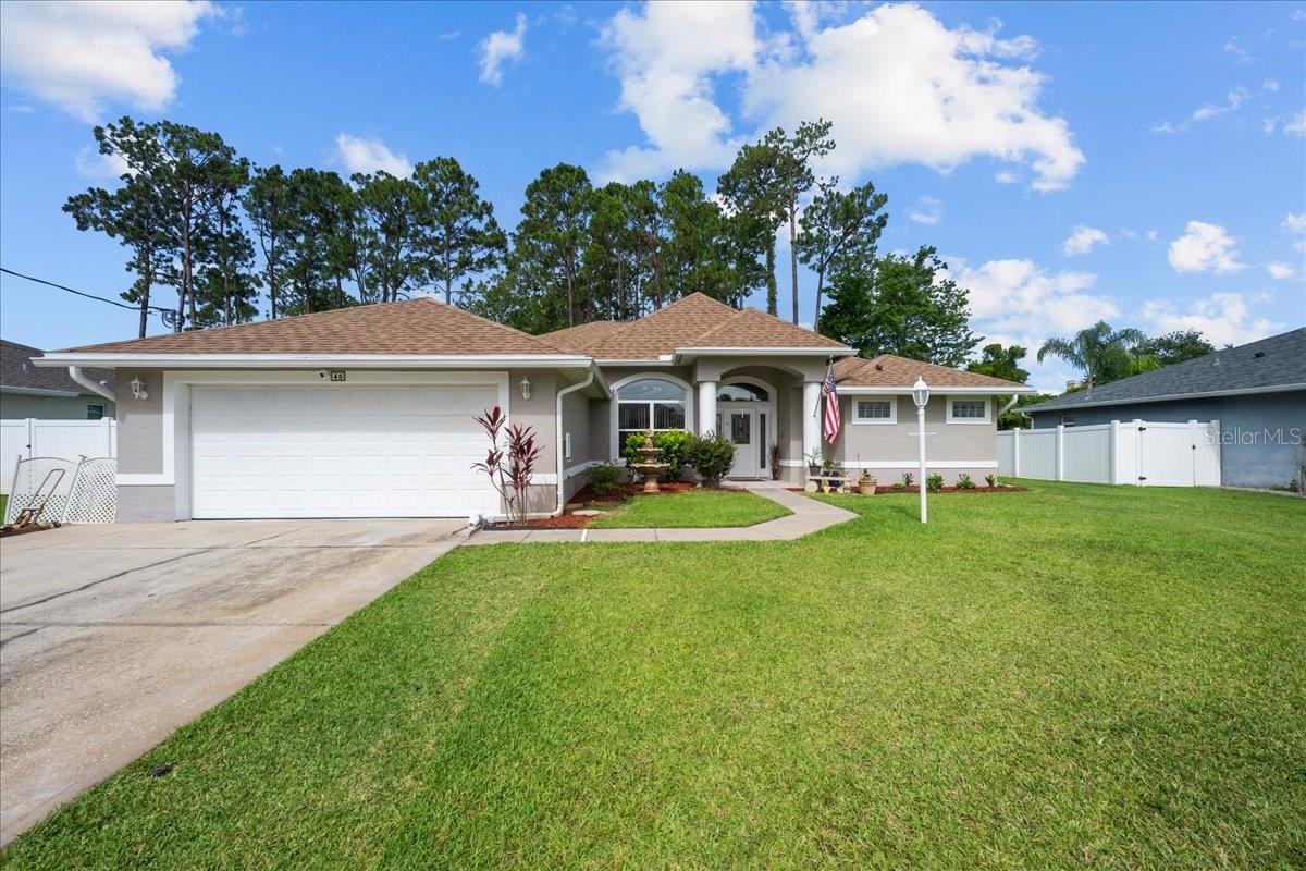 Live the ultimate Florida lifestyle in this stunning, meticulously maintained home with a fully screened, solar-heated POOL and rare third full bathroom—perfect for pool days or rinsing off after the beach! Located just minutes from Palm Coast's beautiful shoreline and the brand-new Town Center with Super Target, shopping, dining, and entertainment. Enjoy an open split floor plan with soaring ceilings, tile and laminate floors, and a spacious primary suite featuring a jetted tub and walk-in closet. The kitchen opens to the main living space, ideal for entertaining. Step outside to your private tropical oasis with covered patio and fenced yard. Nestled in a thriving community seeing tremendous growth, this home offers the best of both worlds: beachside charm and urban convenience. Whether you're relaxing by the pool, hosting friends, or exploring everything Palm Coast has to share—this home delivers. Don't wait—this coastal gem won't last long!